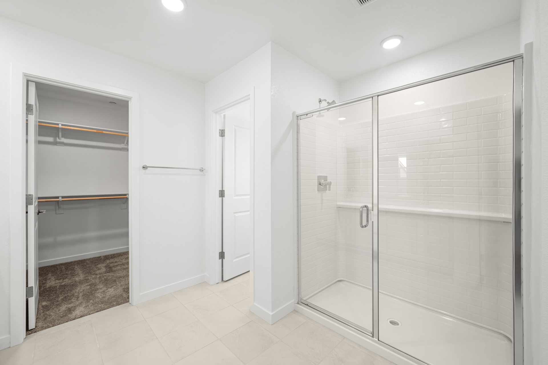 A bathroom with a glass shower.