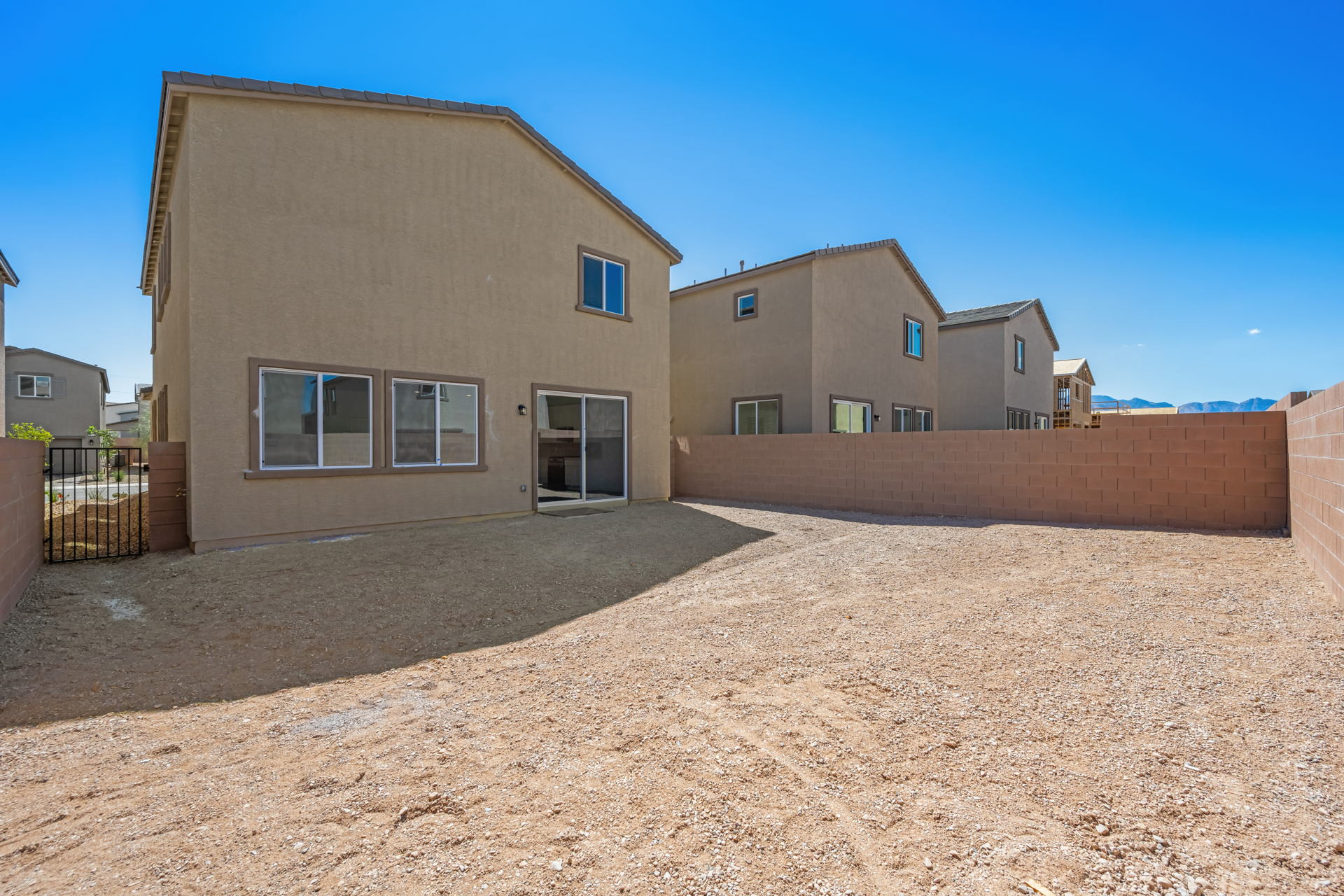 A building with a dirt yard.