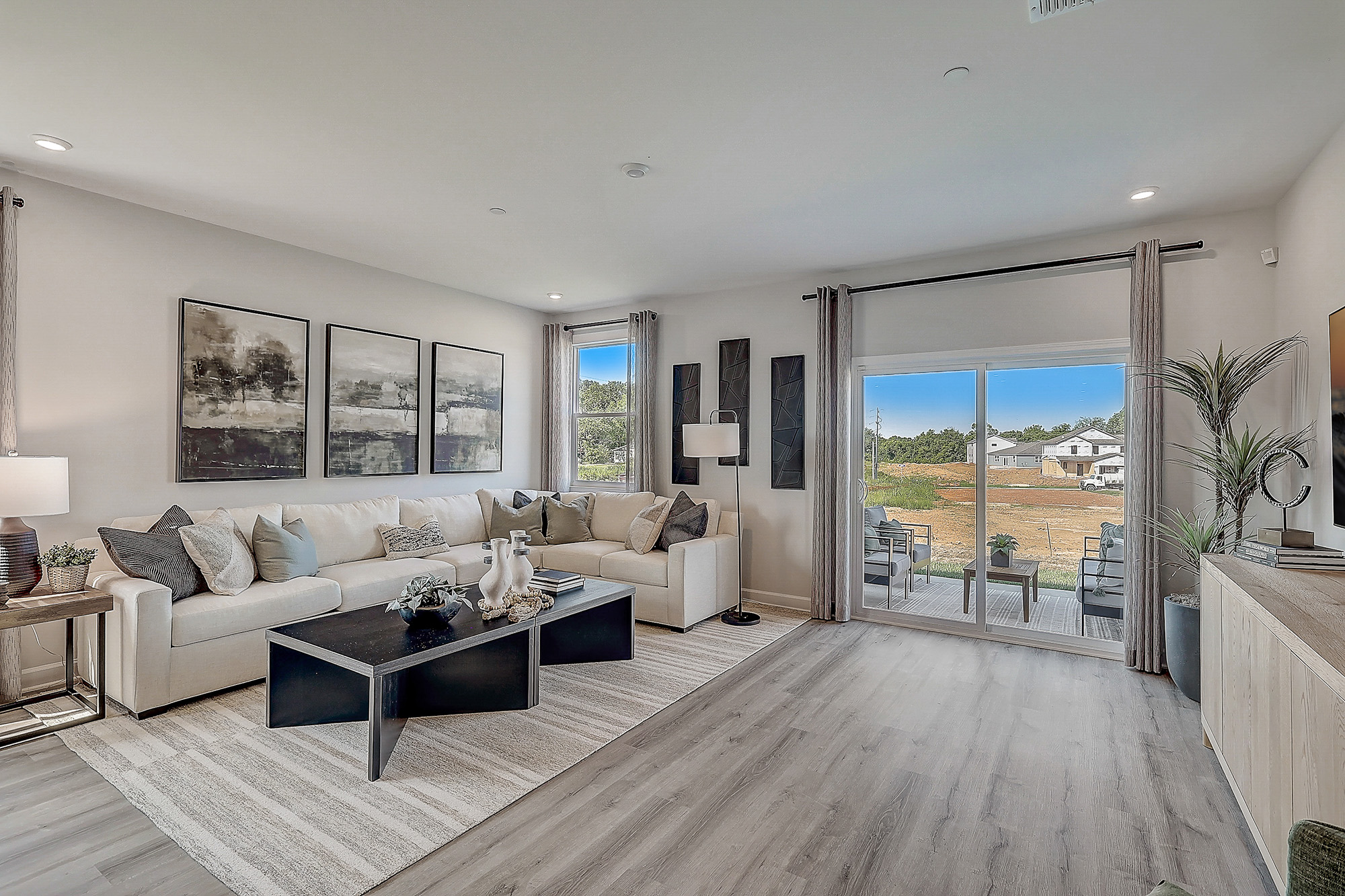 A living room with a large window.