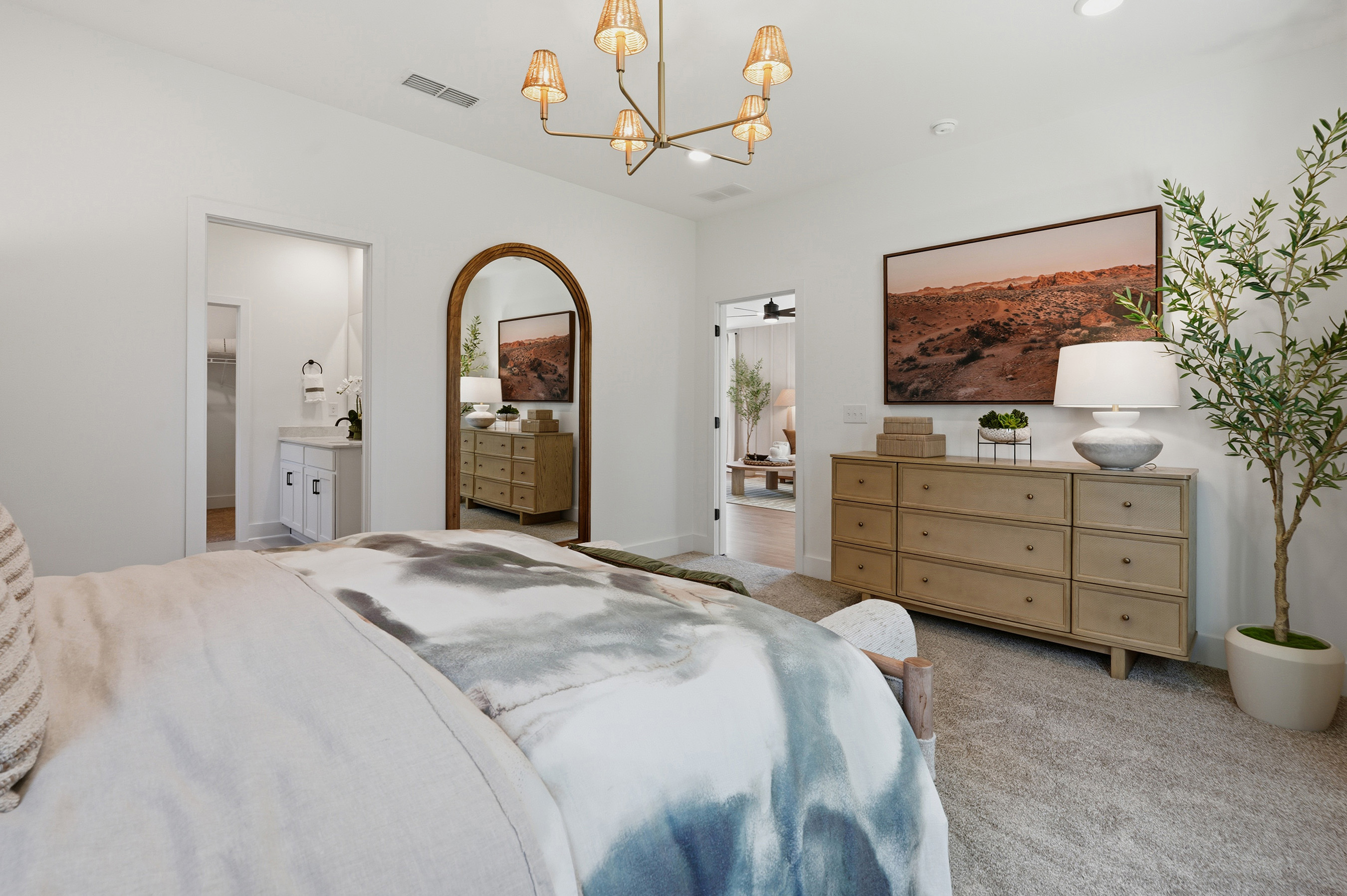 A bedroom with a large bed.