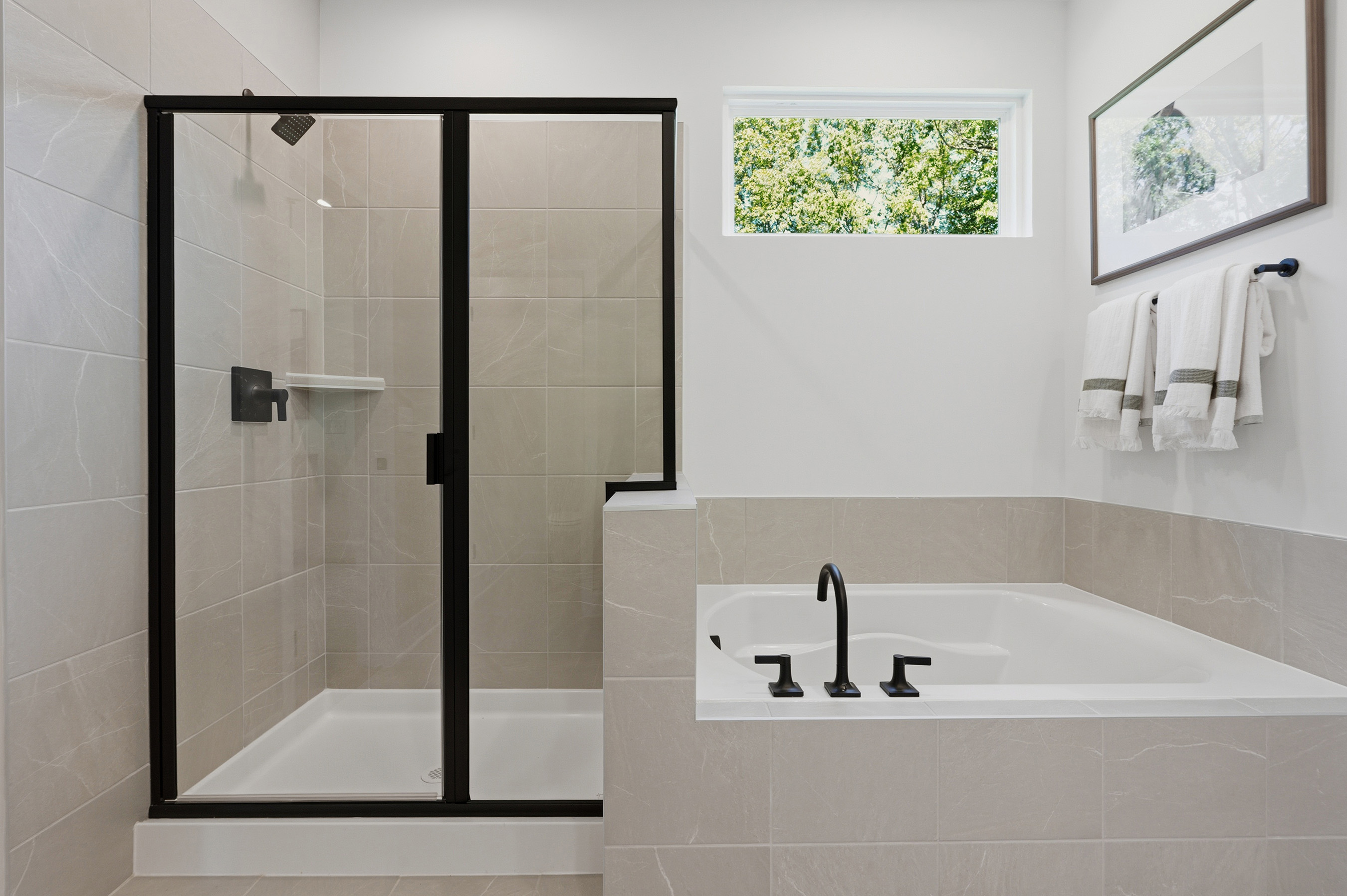 A bathroom with a glass shower.