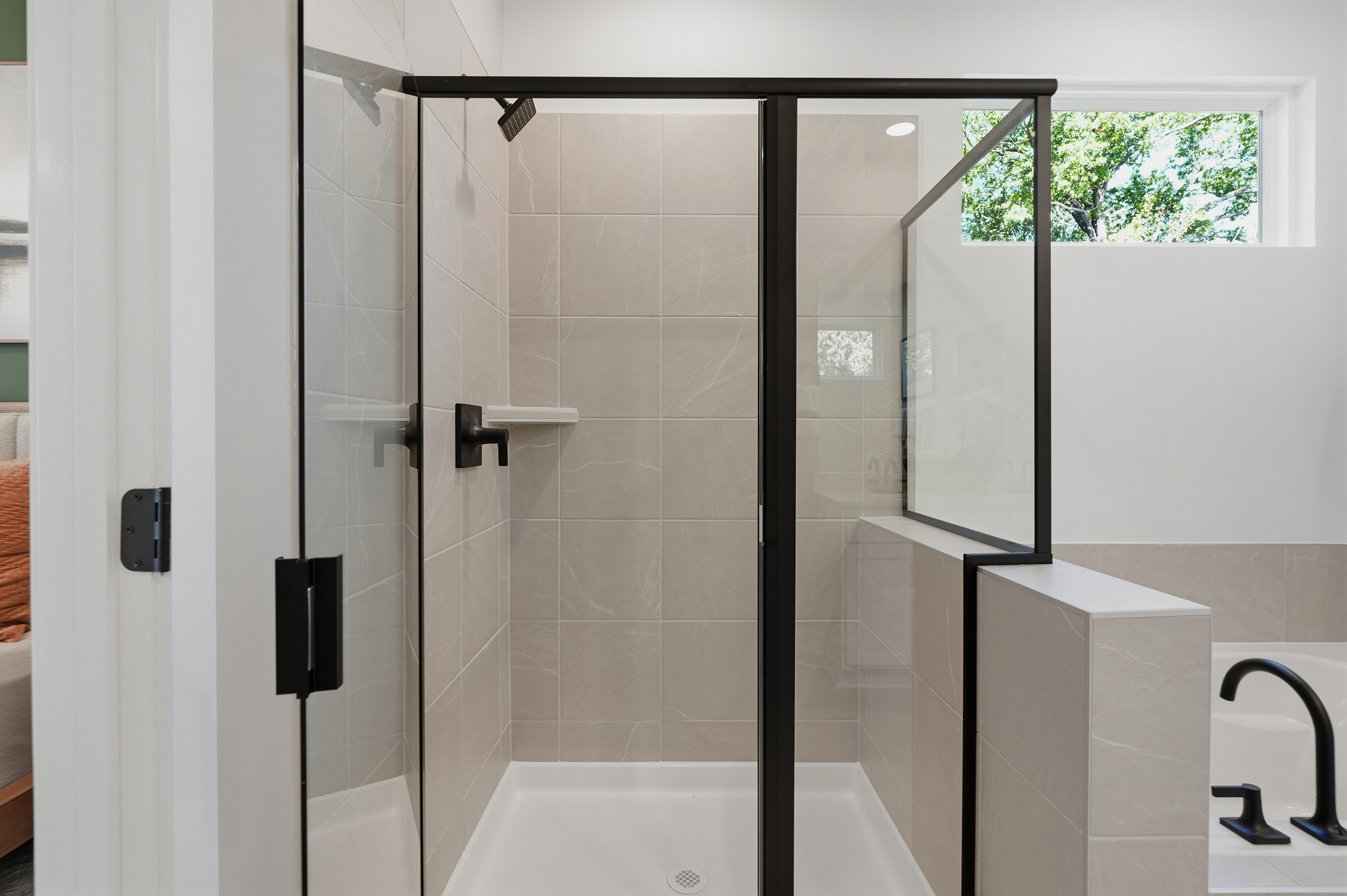 A bathroom with a glass shower.