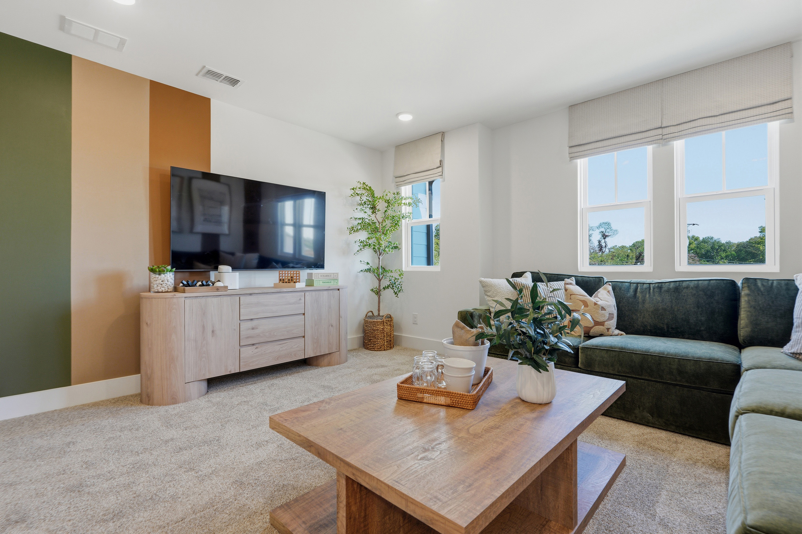 A living room with a couch and a table.