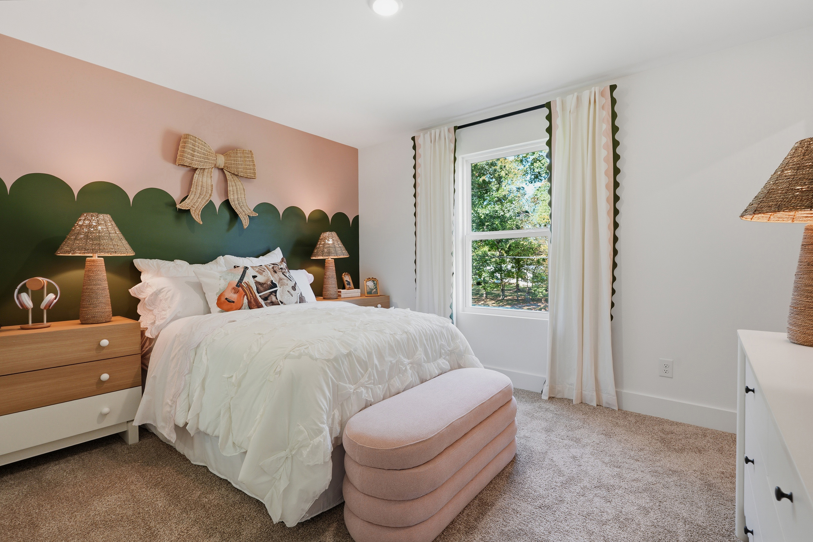 A bedroom with a bed and a window.