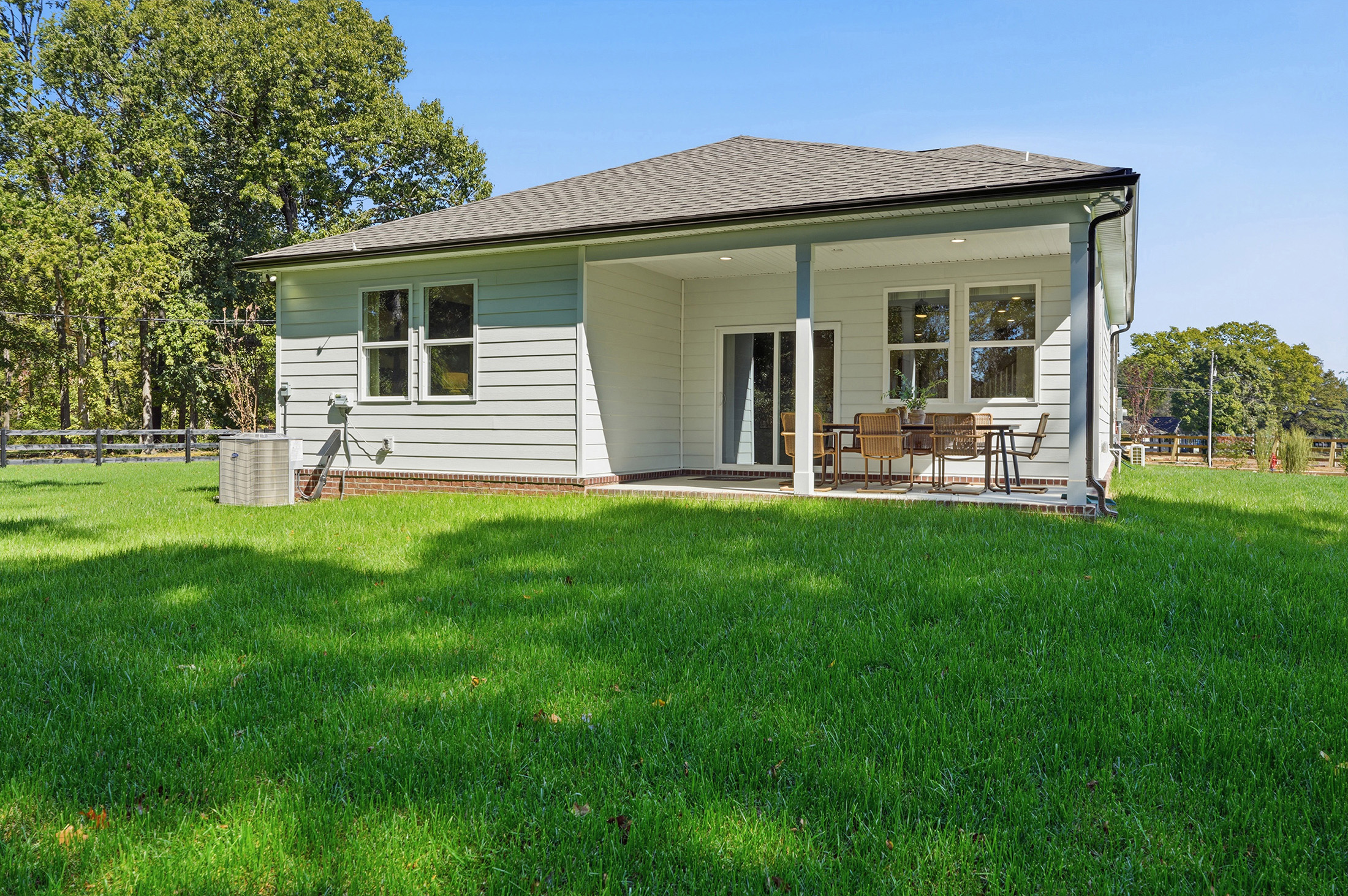 A house with a lawn in front of it.