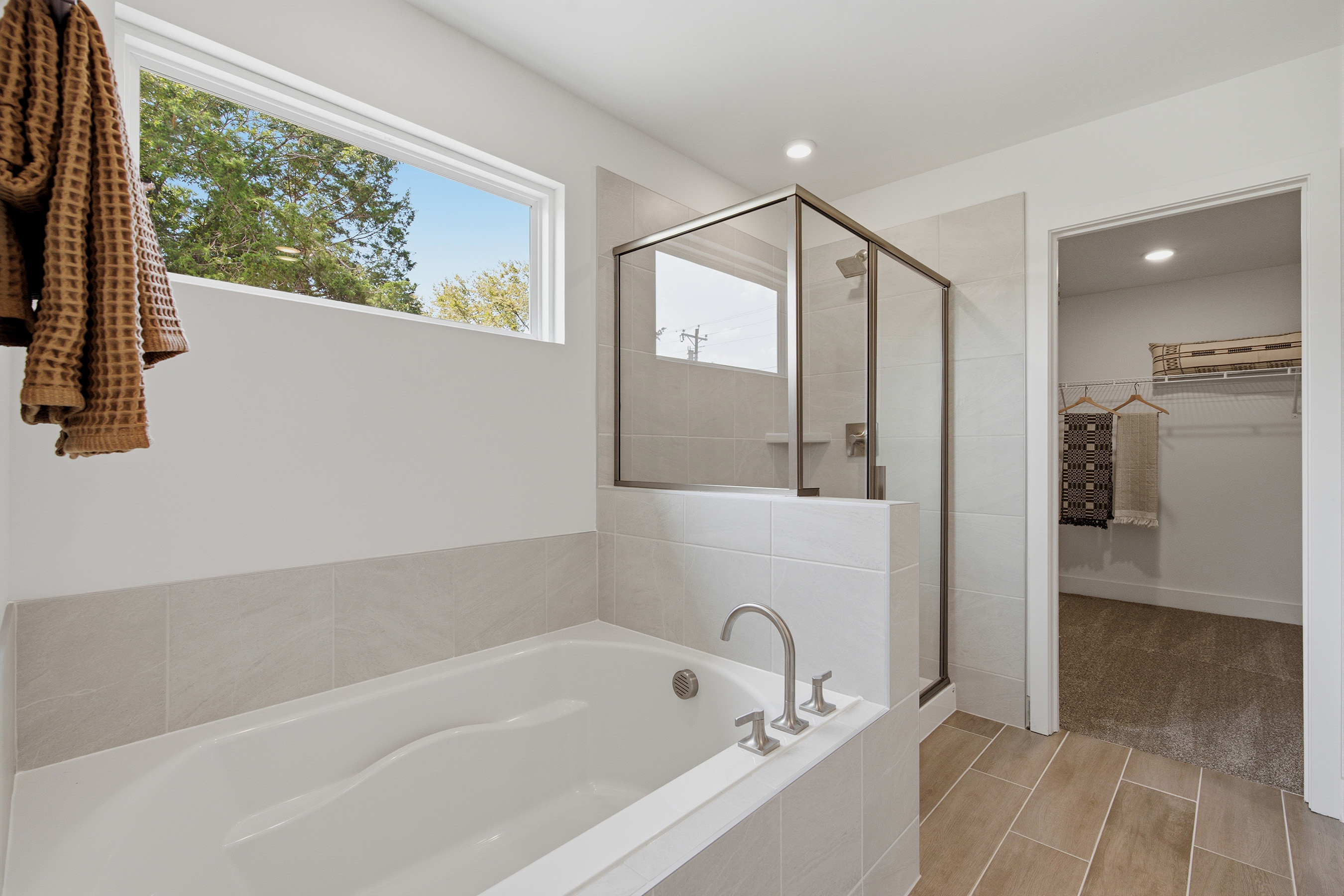 A bathroom with a tub and shower.