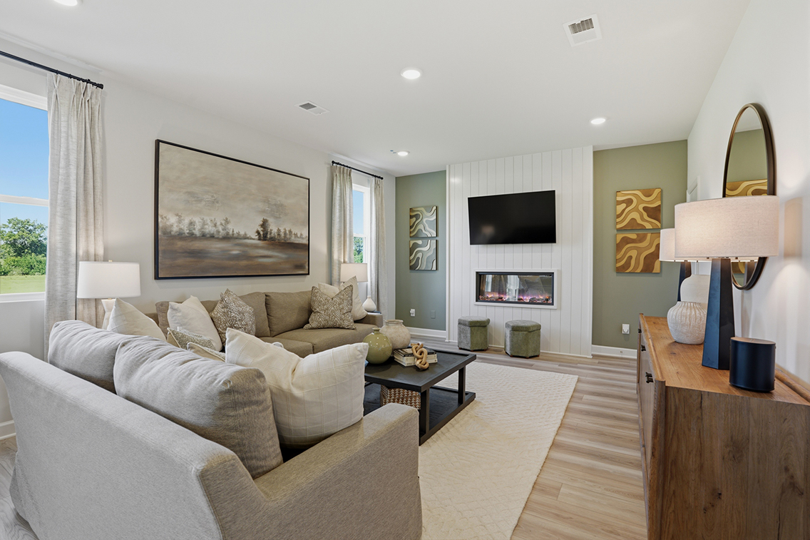 A living room with a large television.
