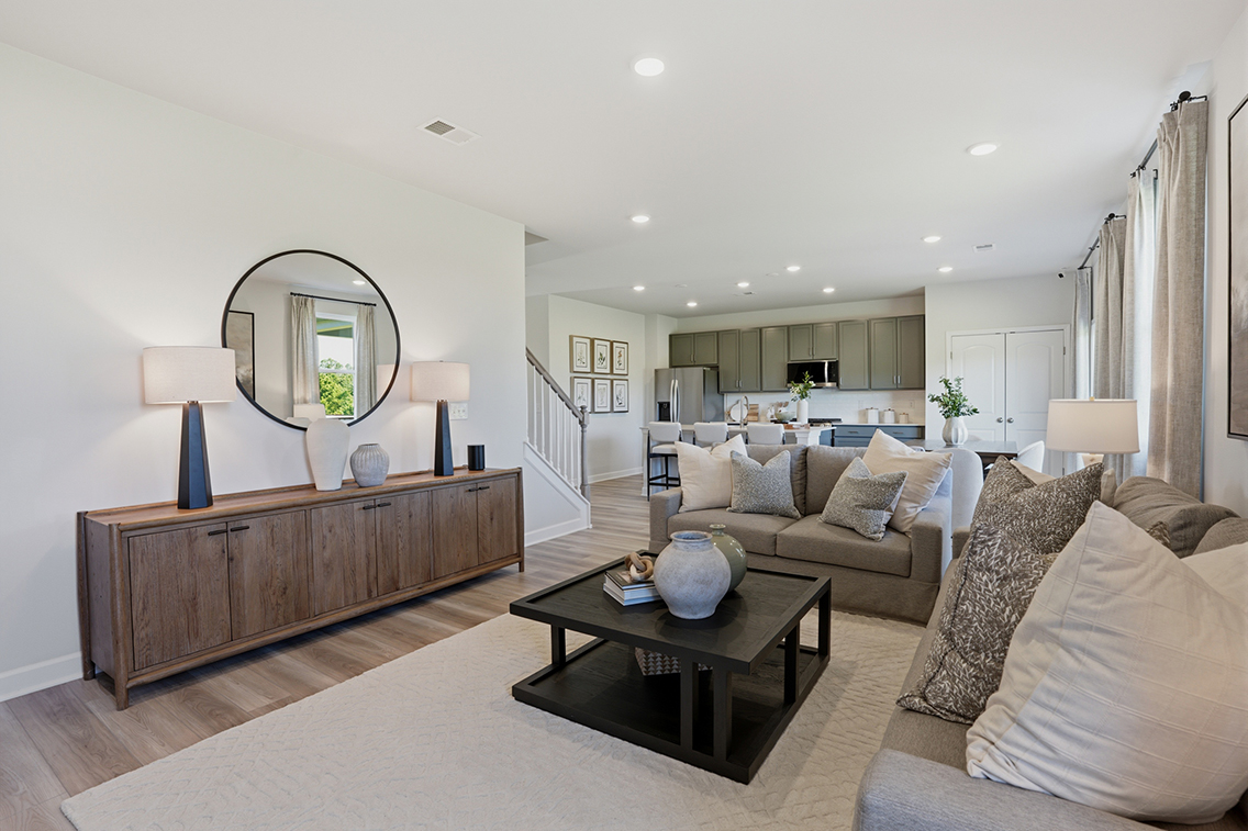 A living room with a large mirror.