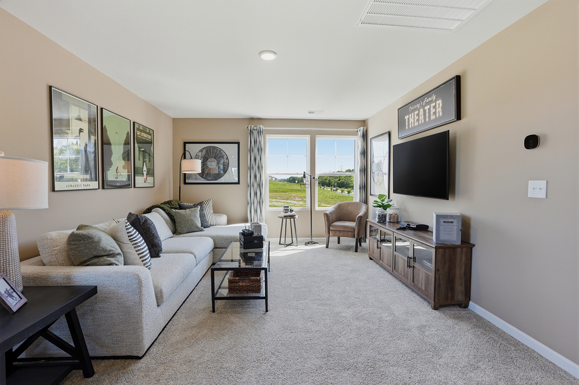 A living room with a tv and couches.
