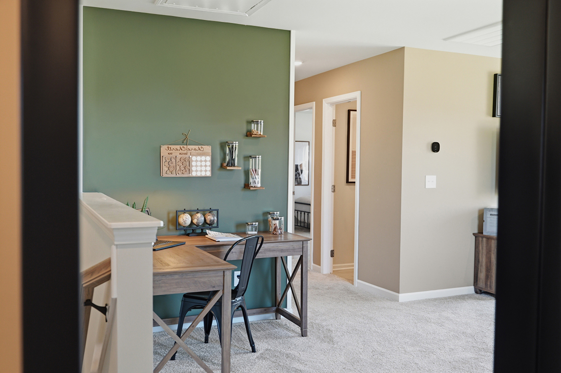A room with a desk and a chair.