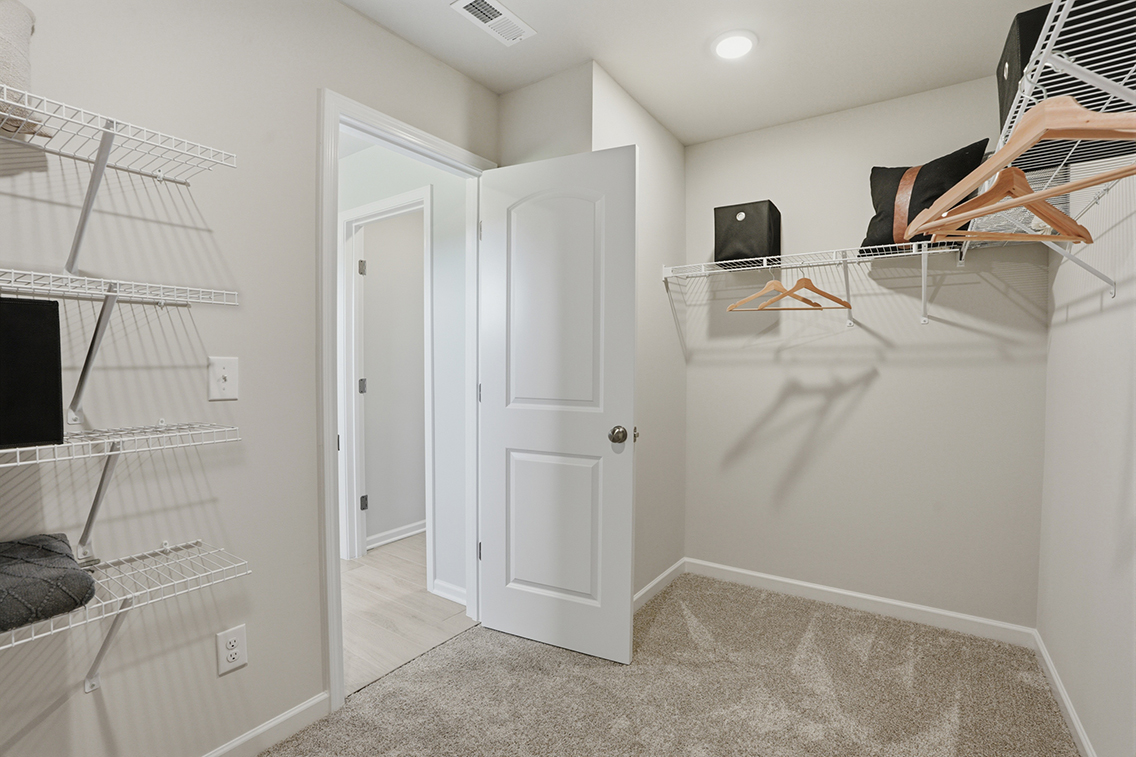 A room with a bed and a tv.