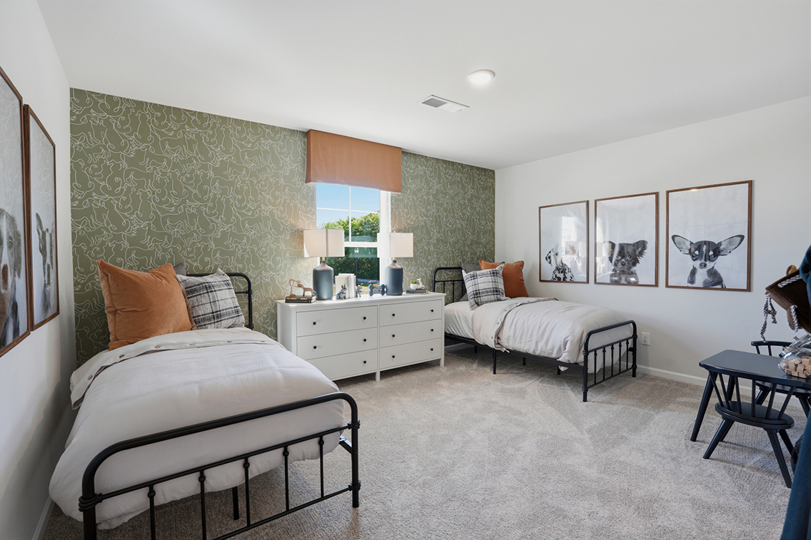 A bedroom with two beds.