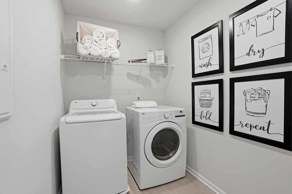 A washer and dryer in a room.