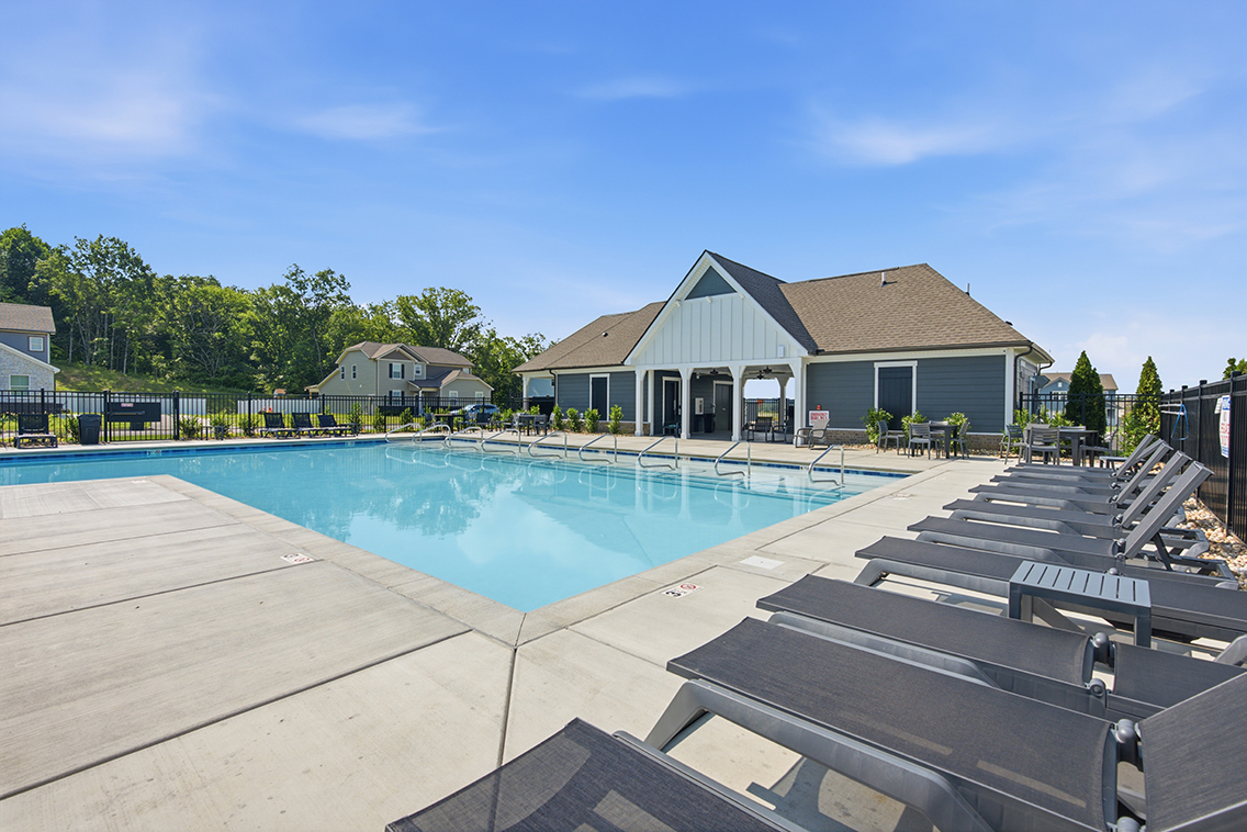 A swimming pool in a backyard.