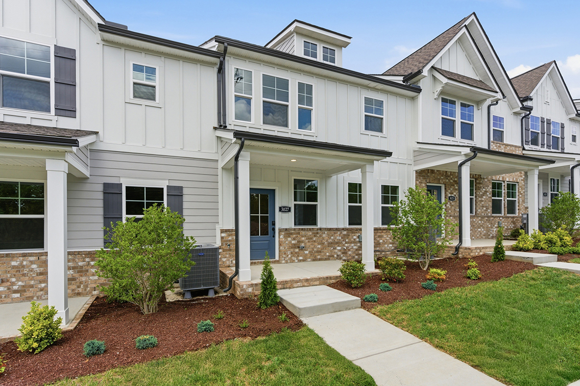 A white house with a driveway.