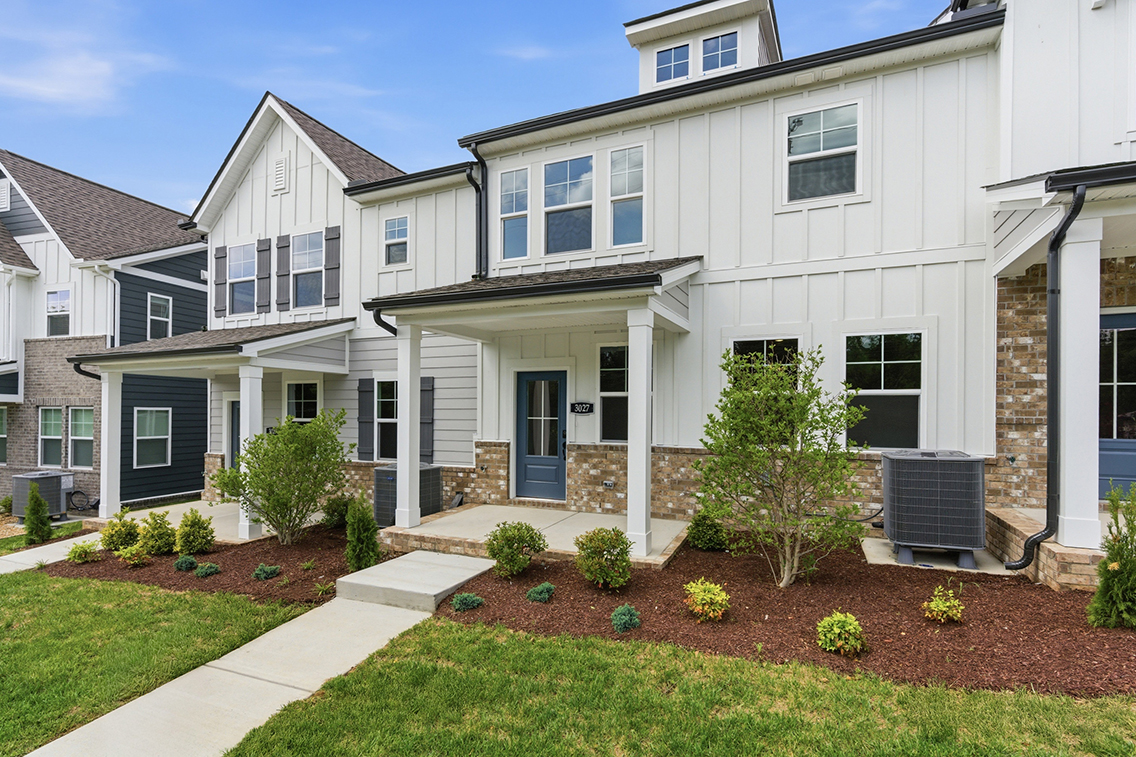 A large house with a driveway.