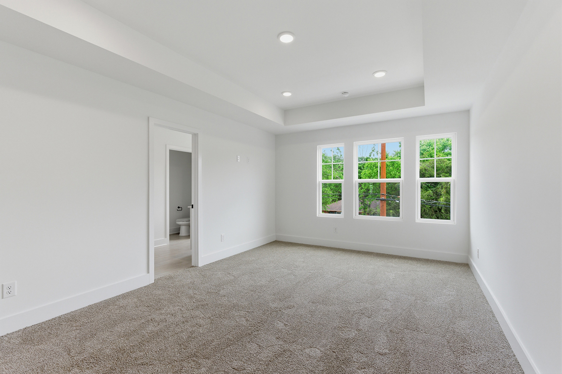 A room with windows and a door.