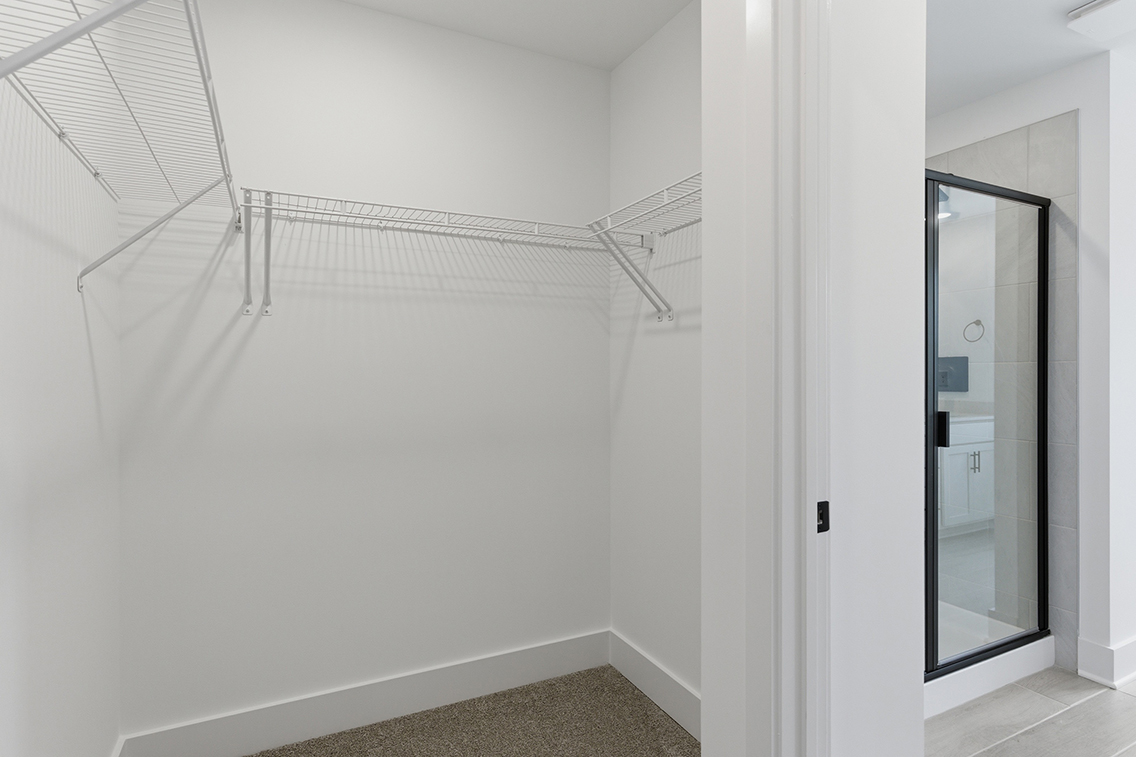 A white room with a glass door.