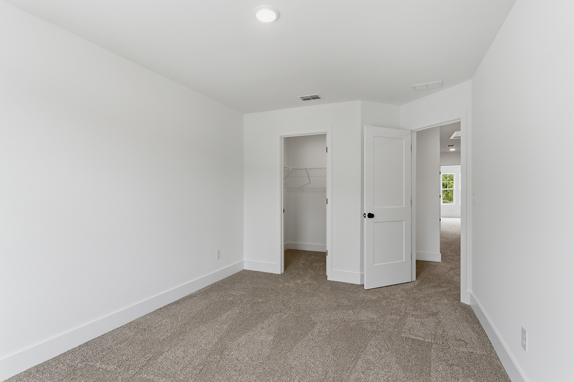 A hallway with white doors.