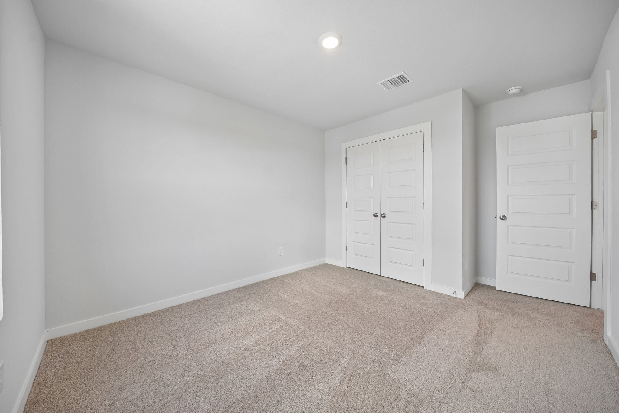 A room with white doors.