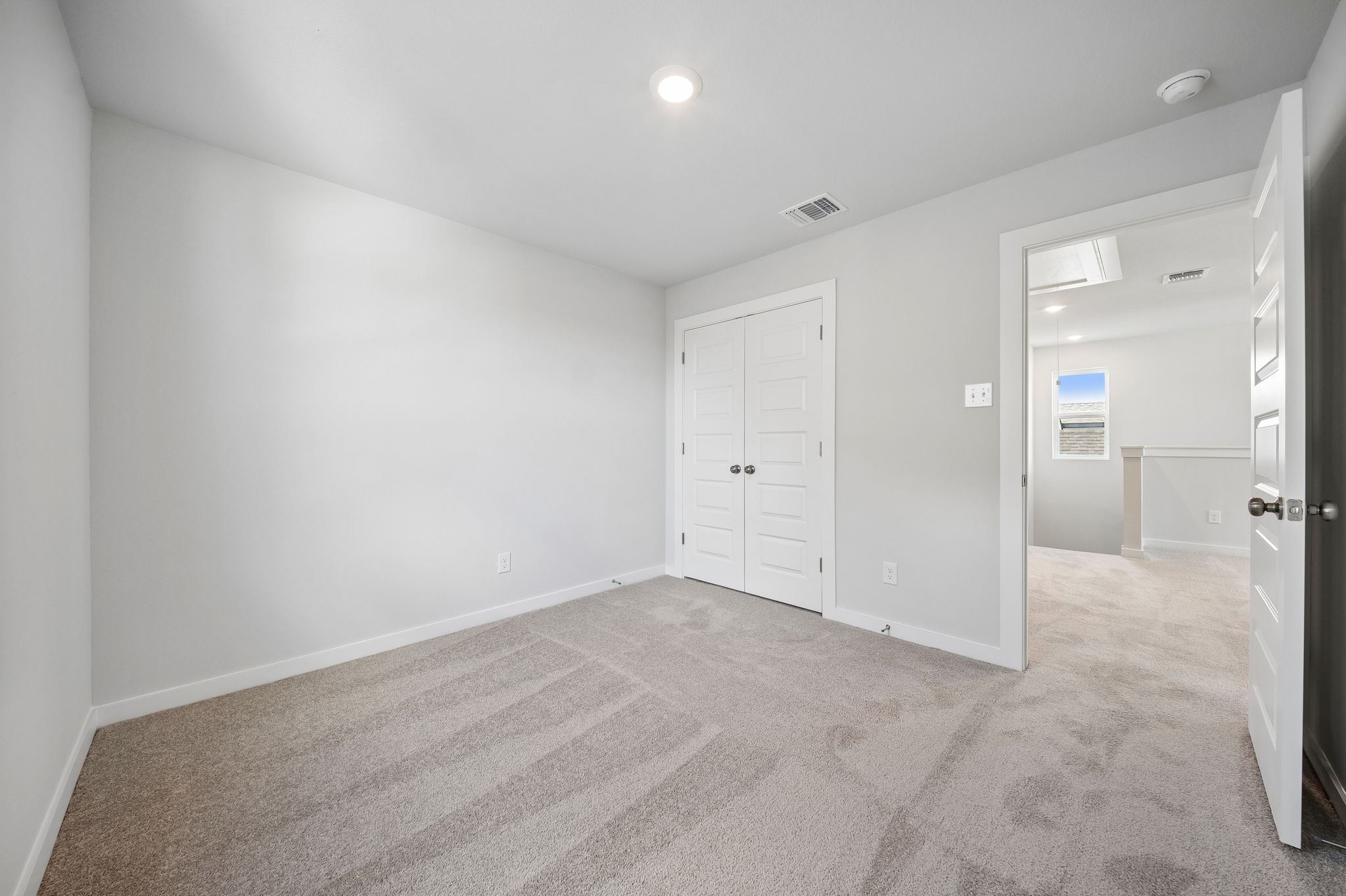 A room with white doors.