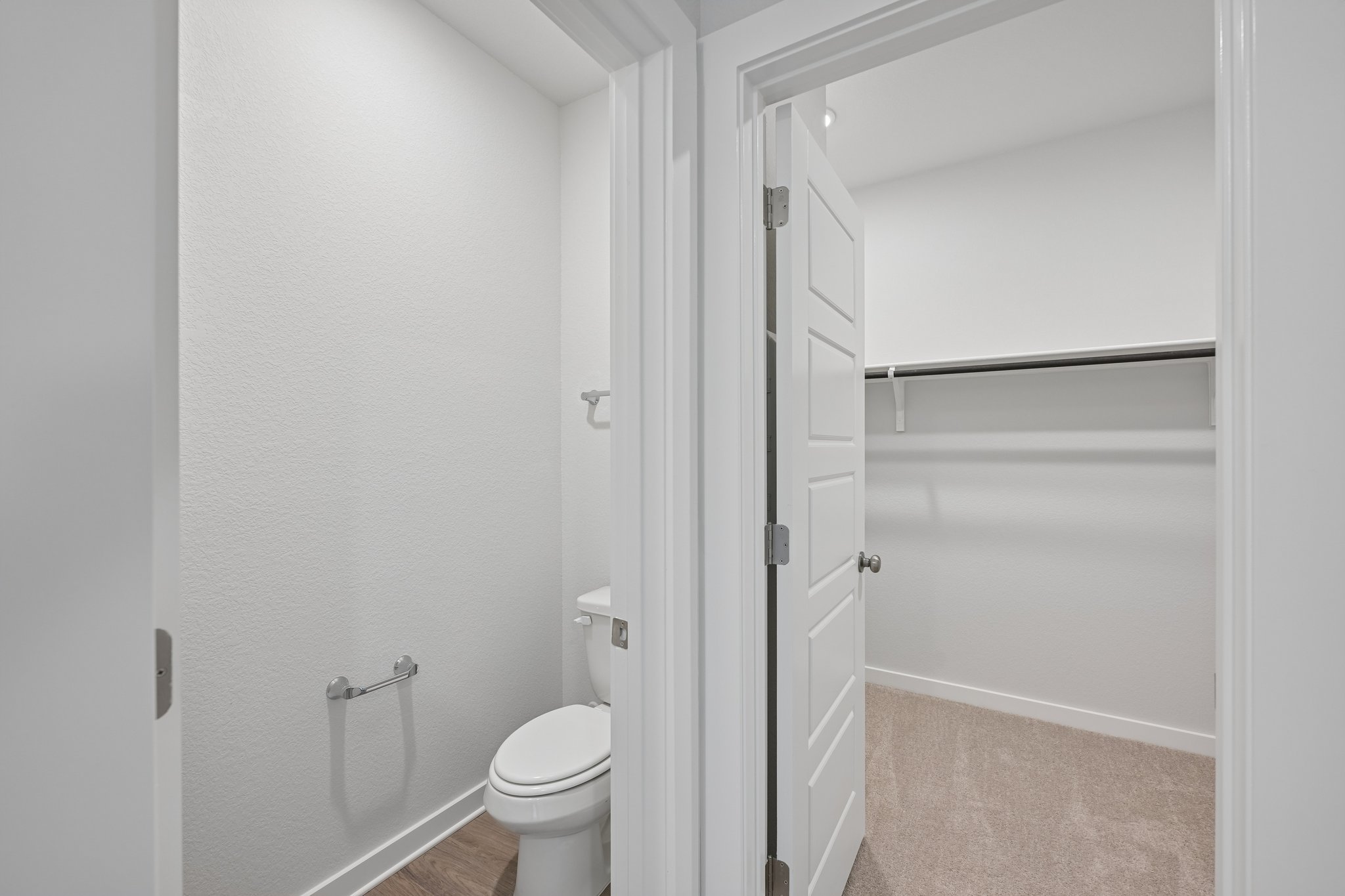 A bathroom with a toilet and shower.