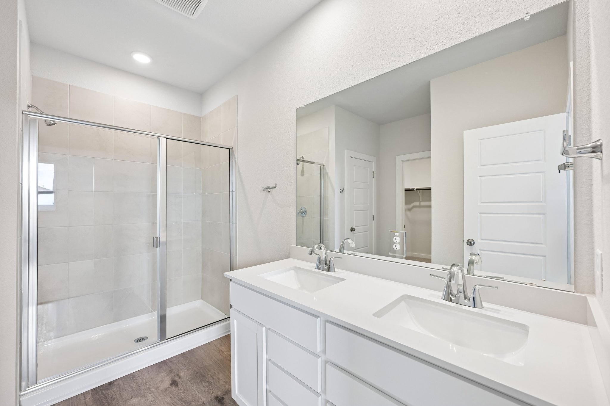 A bathroom with a glass shower.