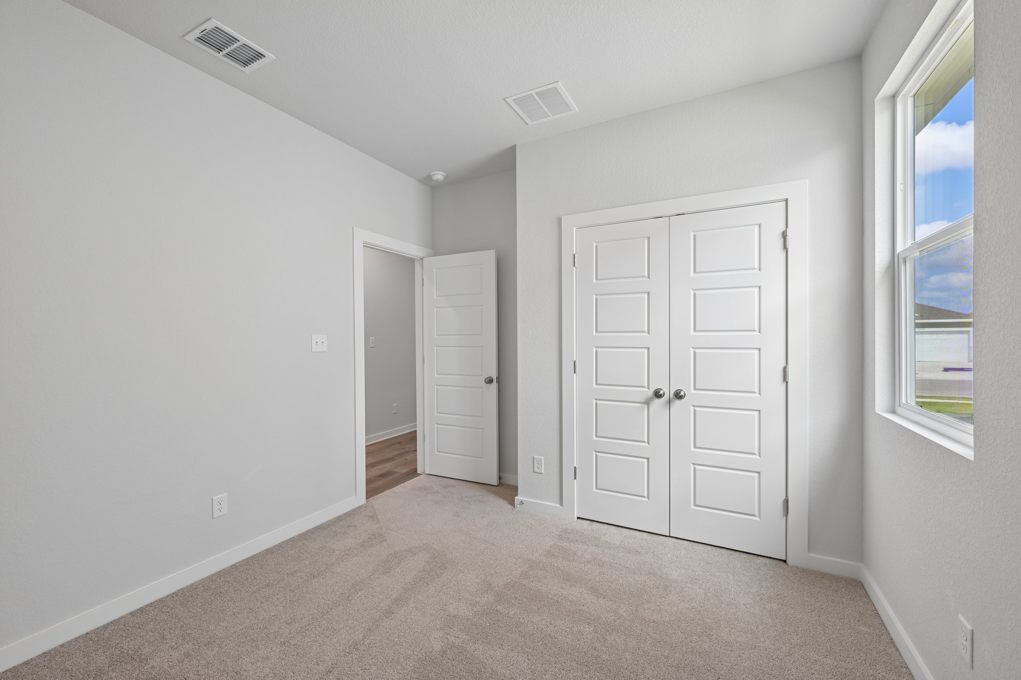 A room with white doors.