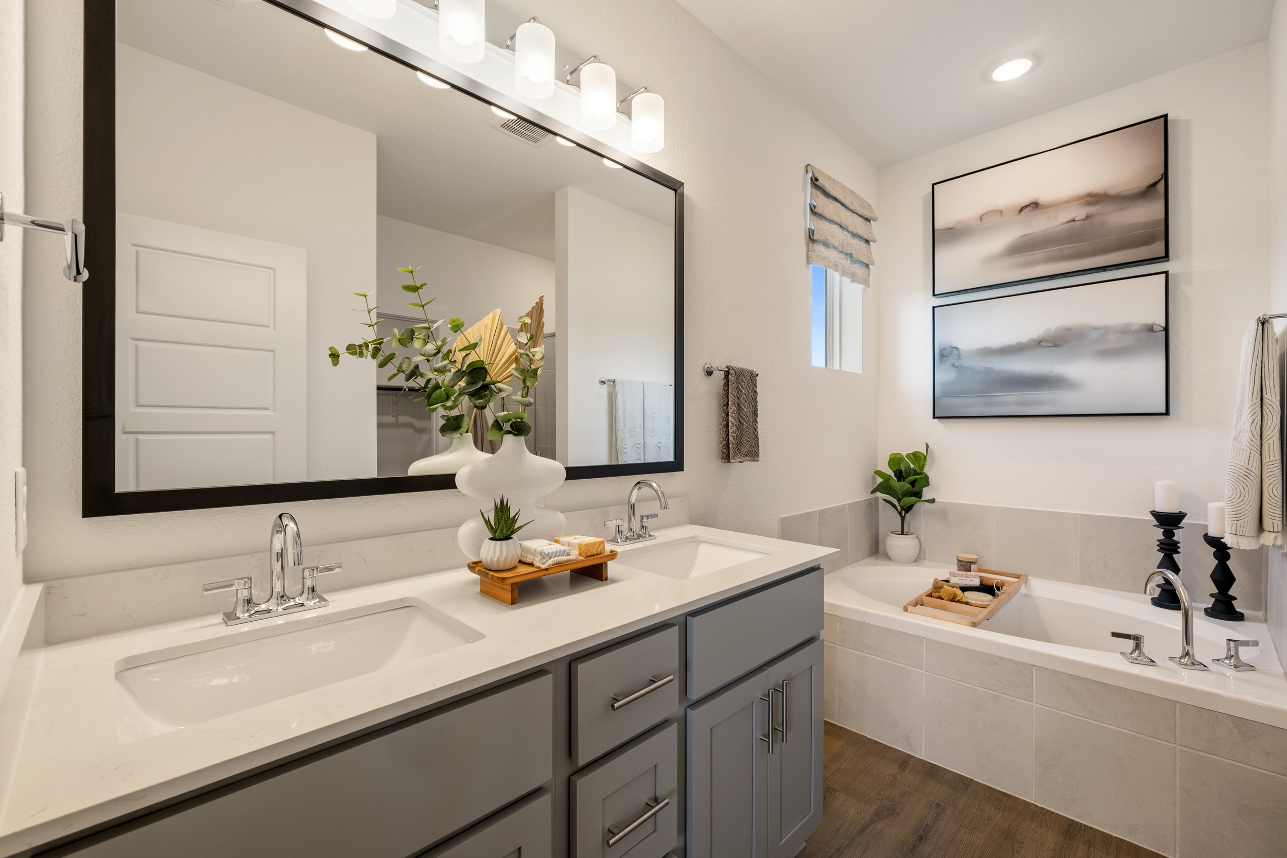 A bathroom with a large mirror.