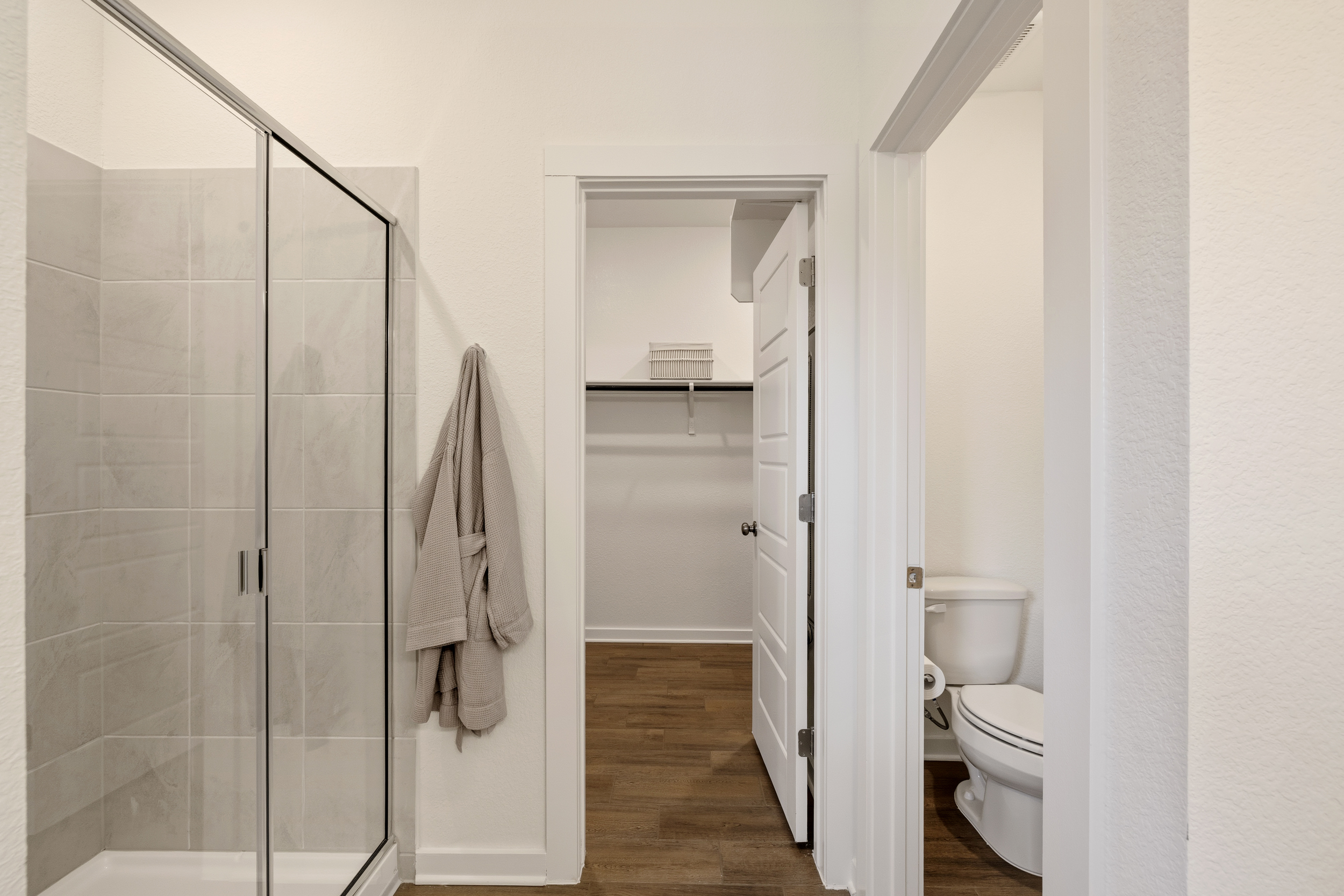 A bathroom with a glass shower.