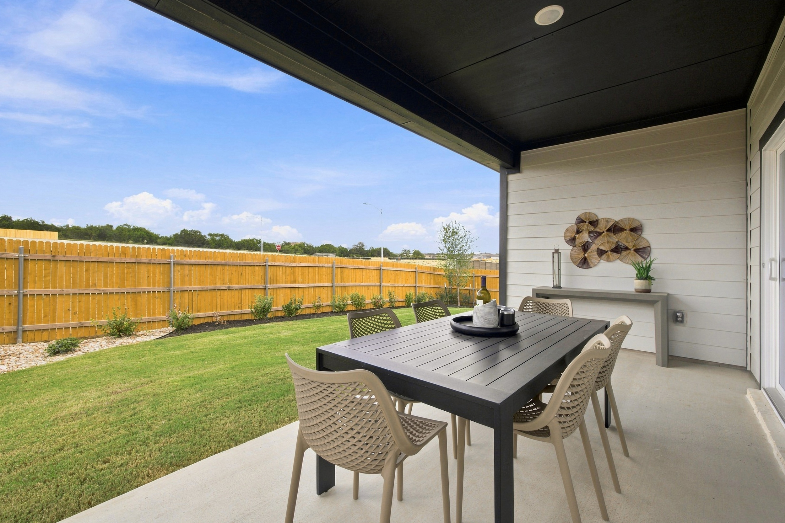 A table and chairs on a deck.