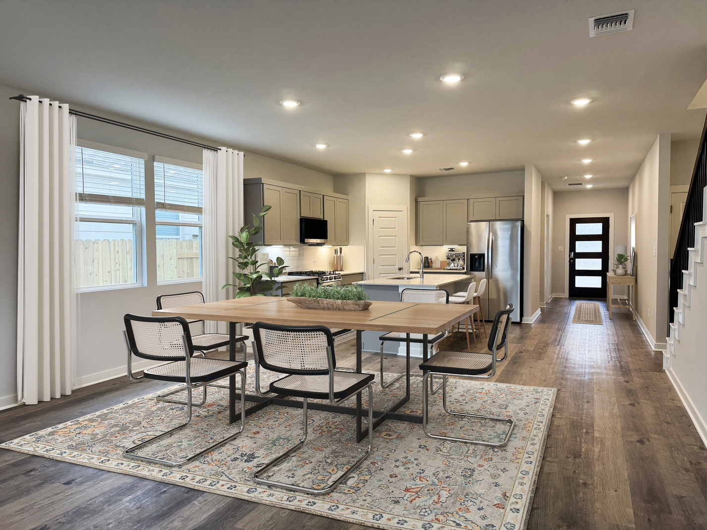 A kitchen with a dining table.