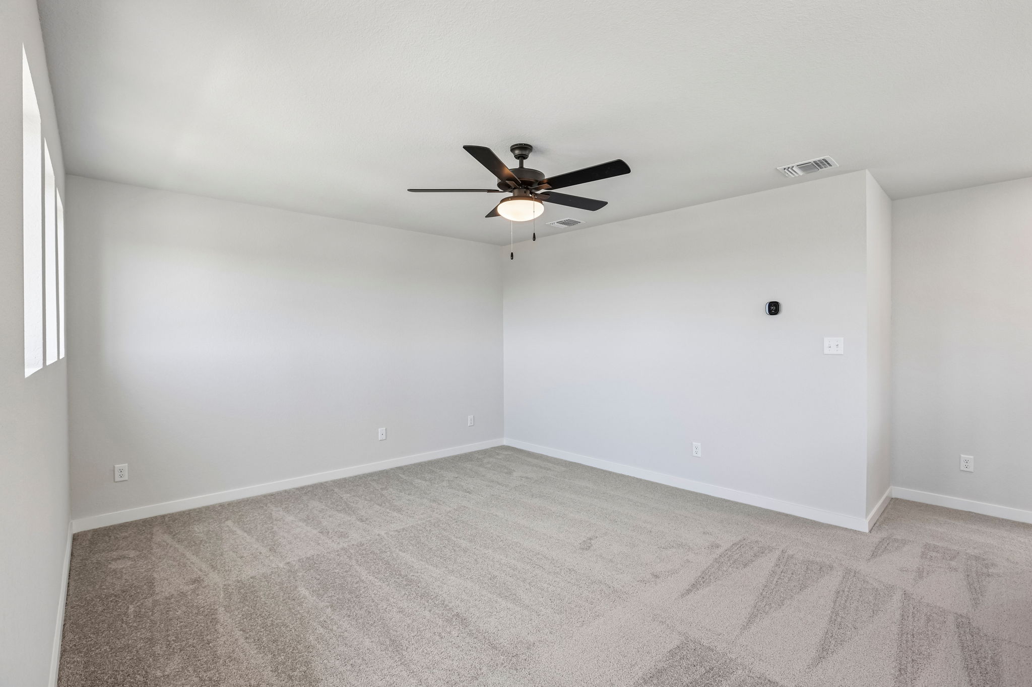 A ceiling fan in a room.