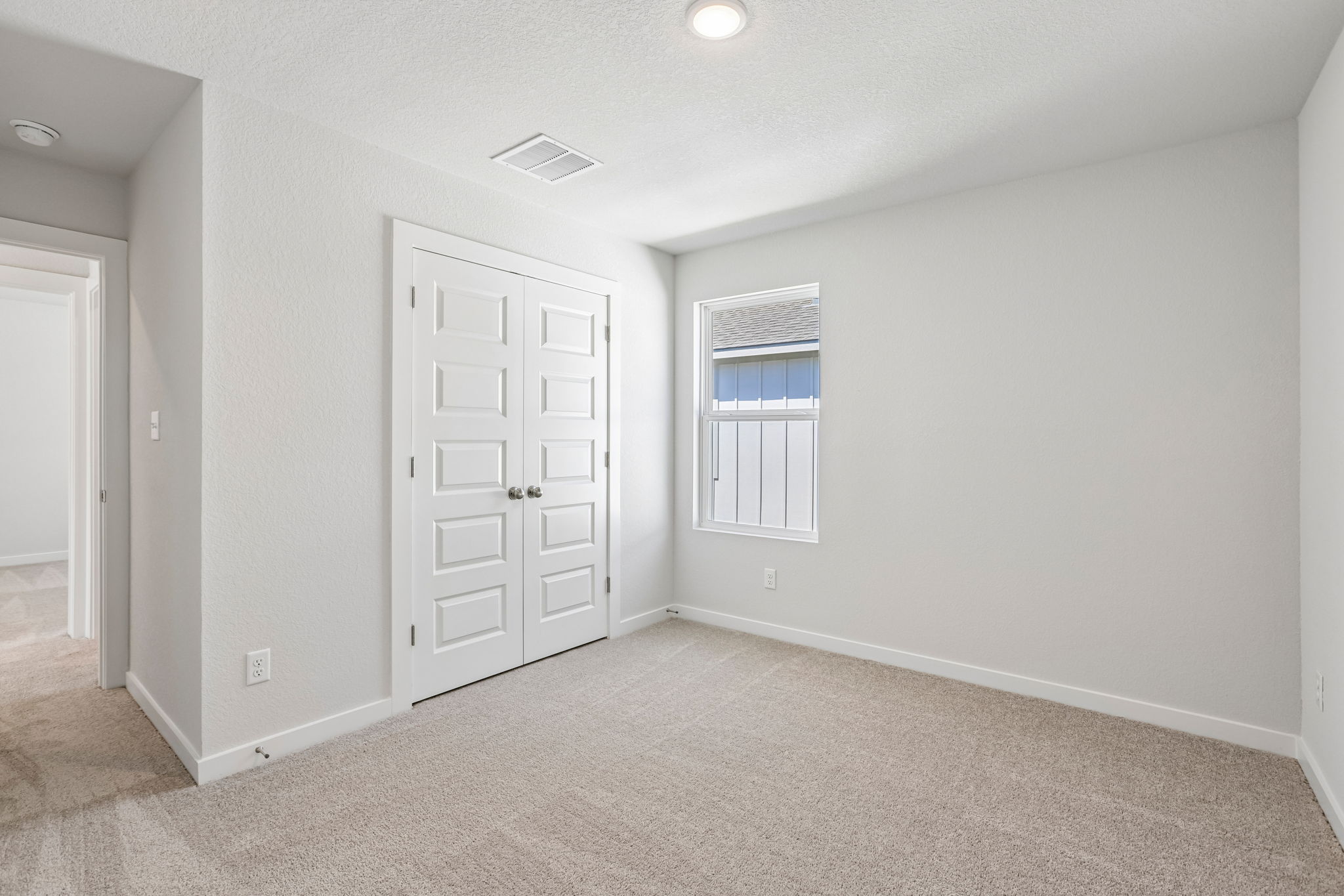 A room with white doors.