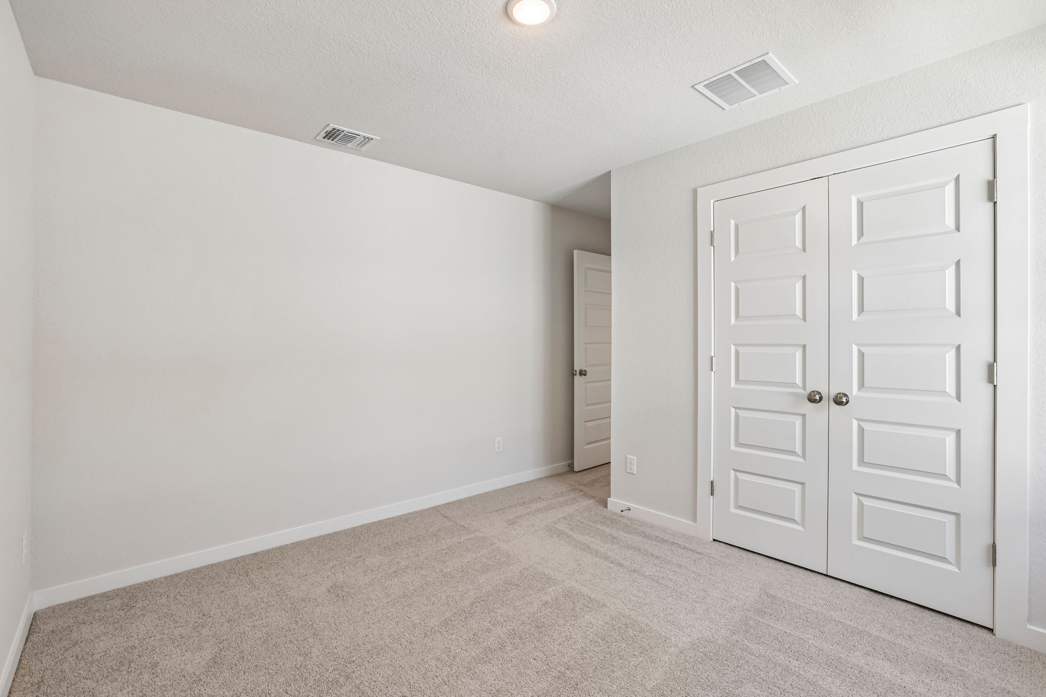 A room with white doors.