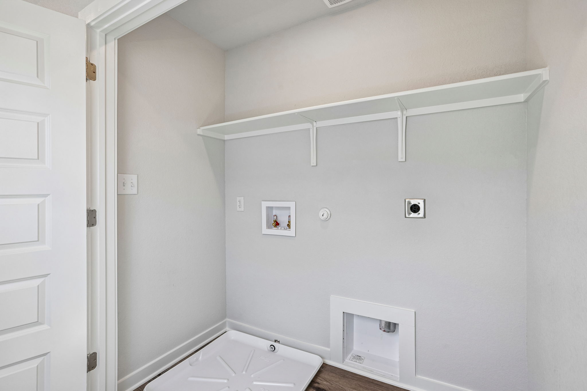 A white room with a white wall.