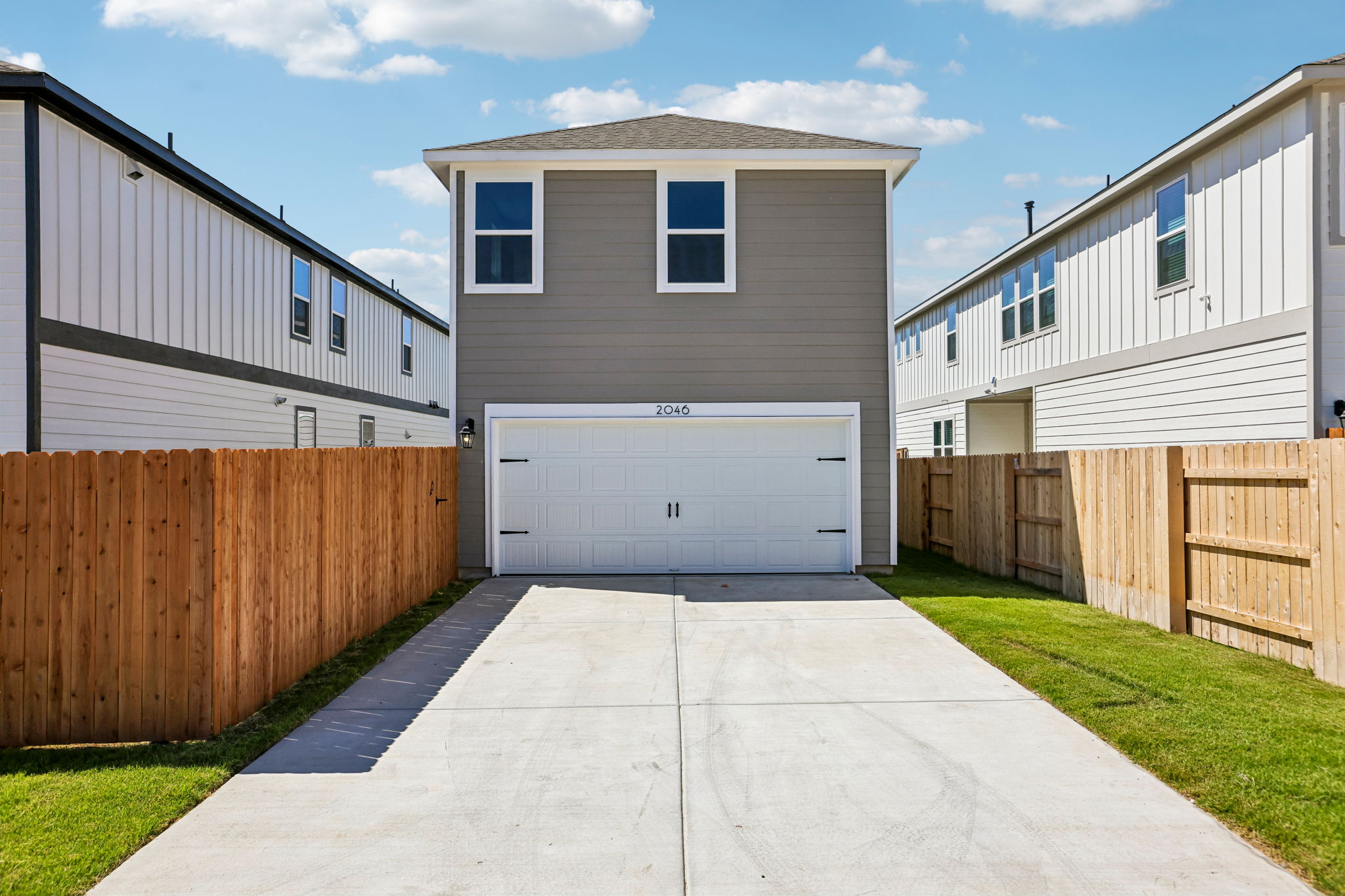 A driveway leading to a building.