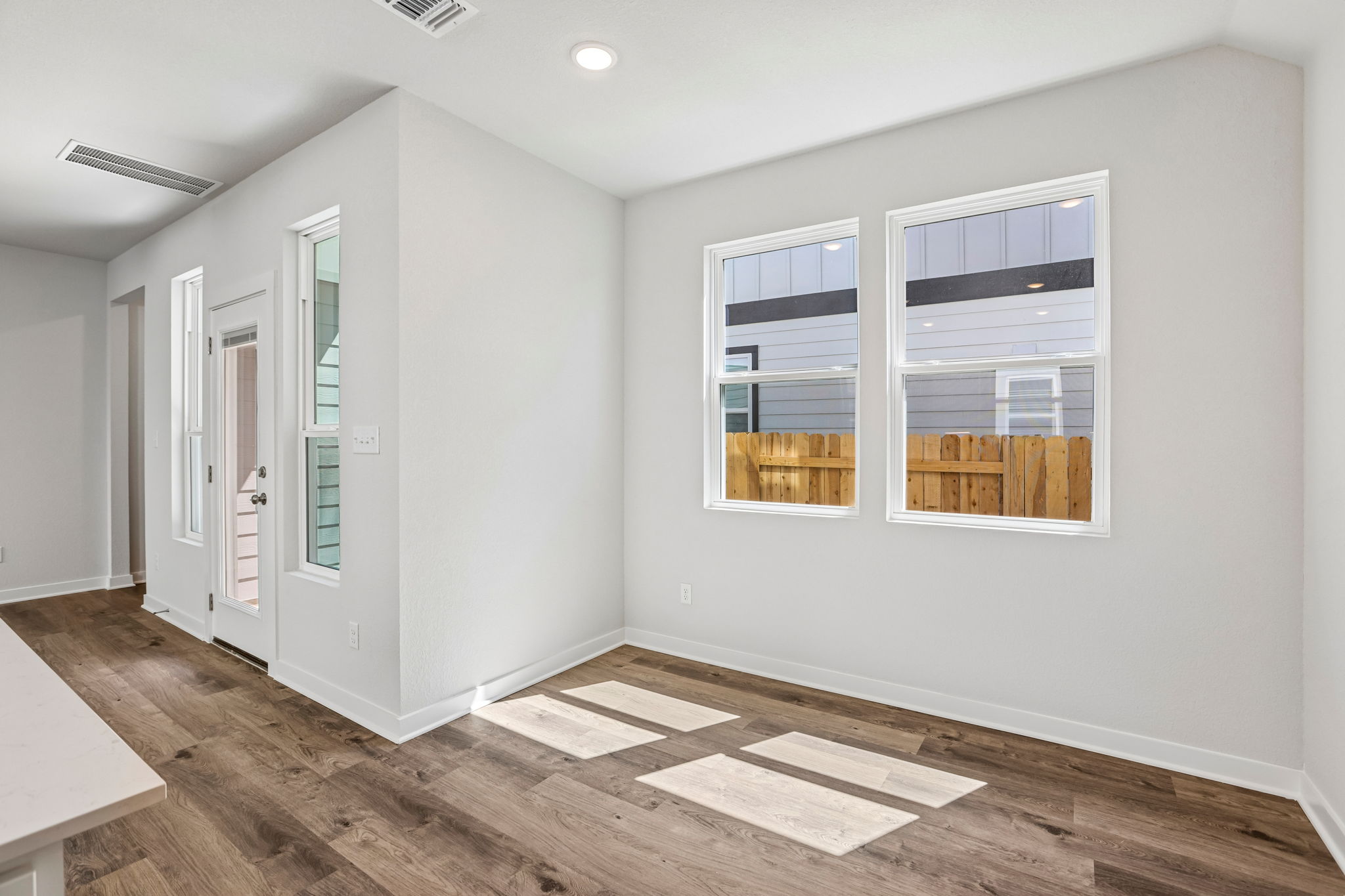A room with white walls and windows.