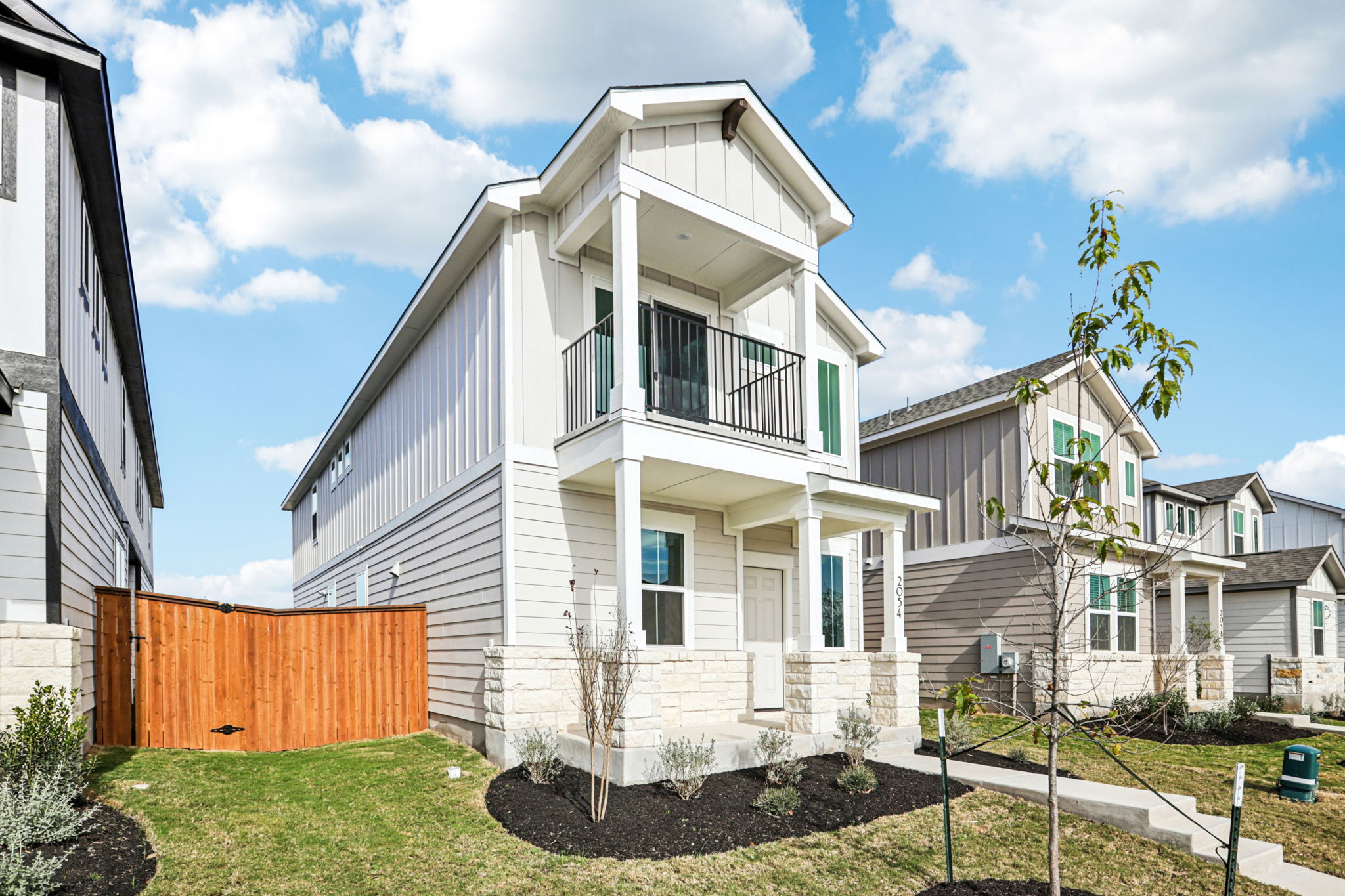 A white house with a fence.