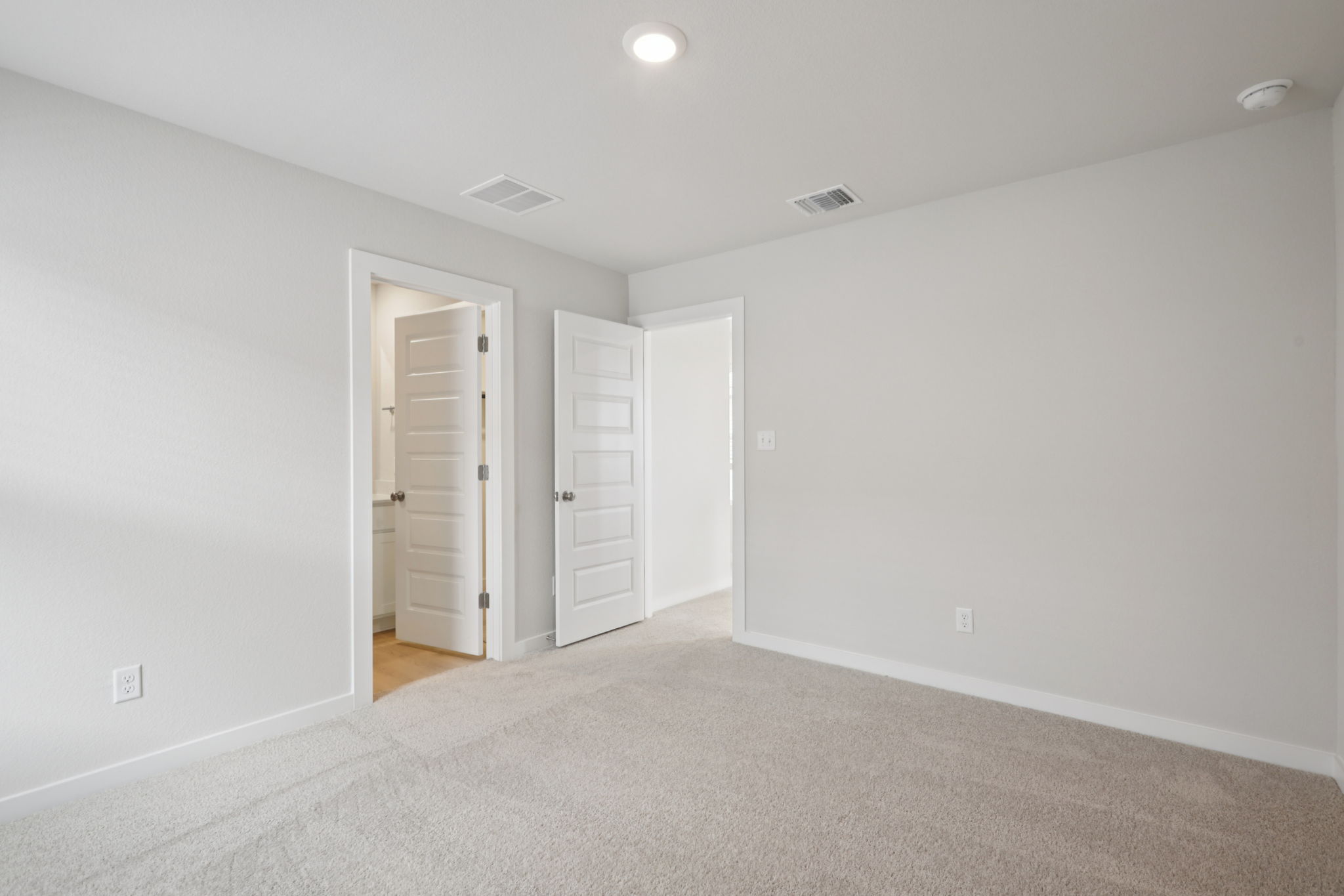 A room with white doors.