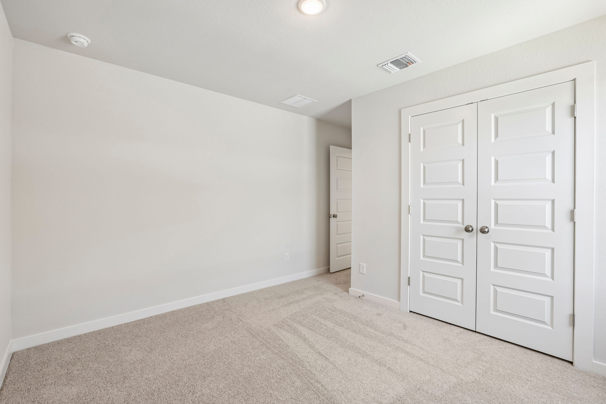 A room with white doors.
