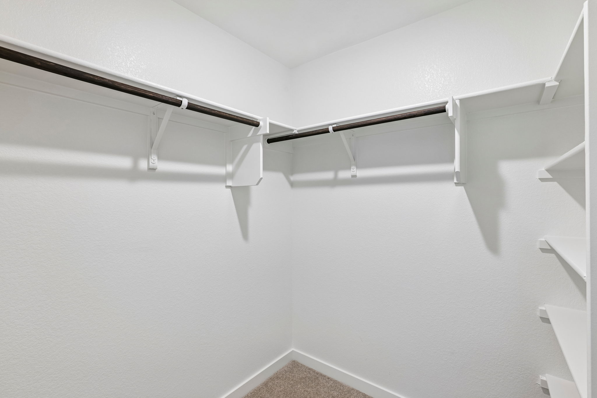 A white staircase with a railing.