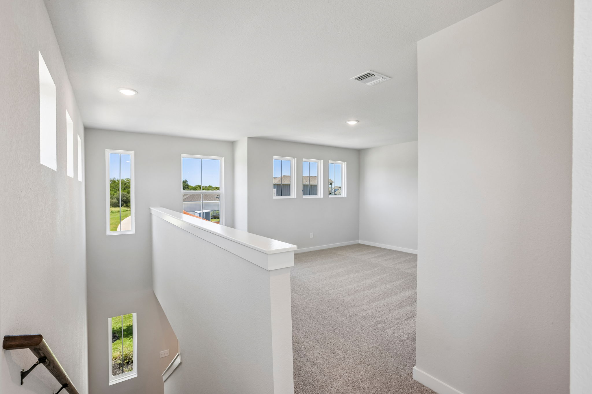 A room with white walls and windows.