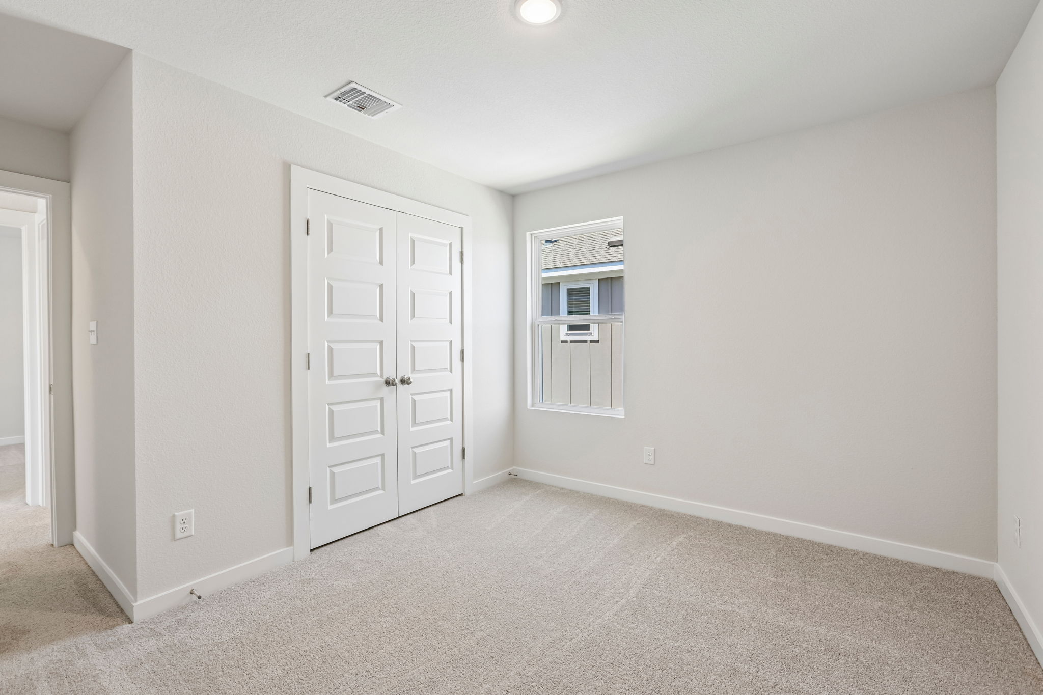 A room with white doors.
