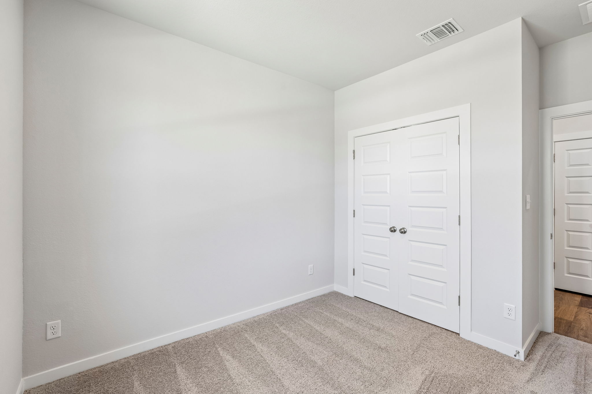 A room with white doors.