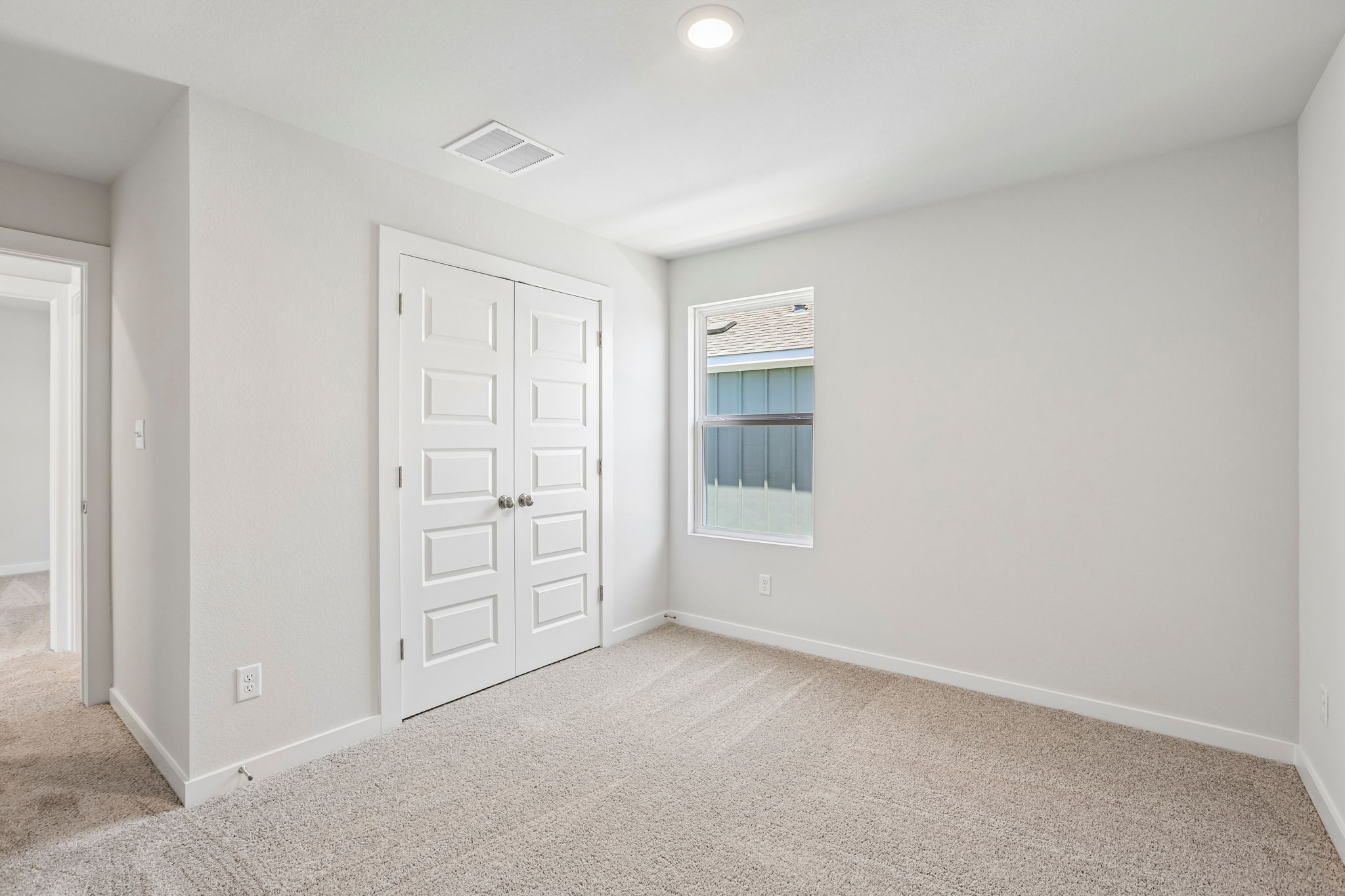 A room with white doors.