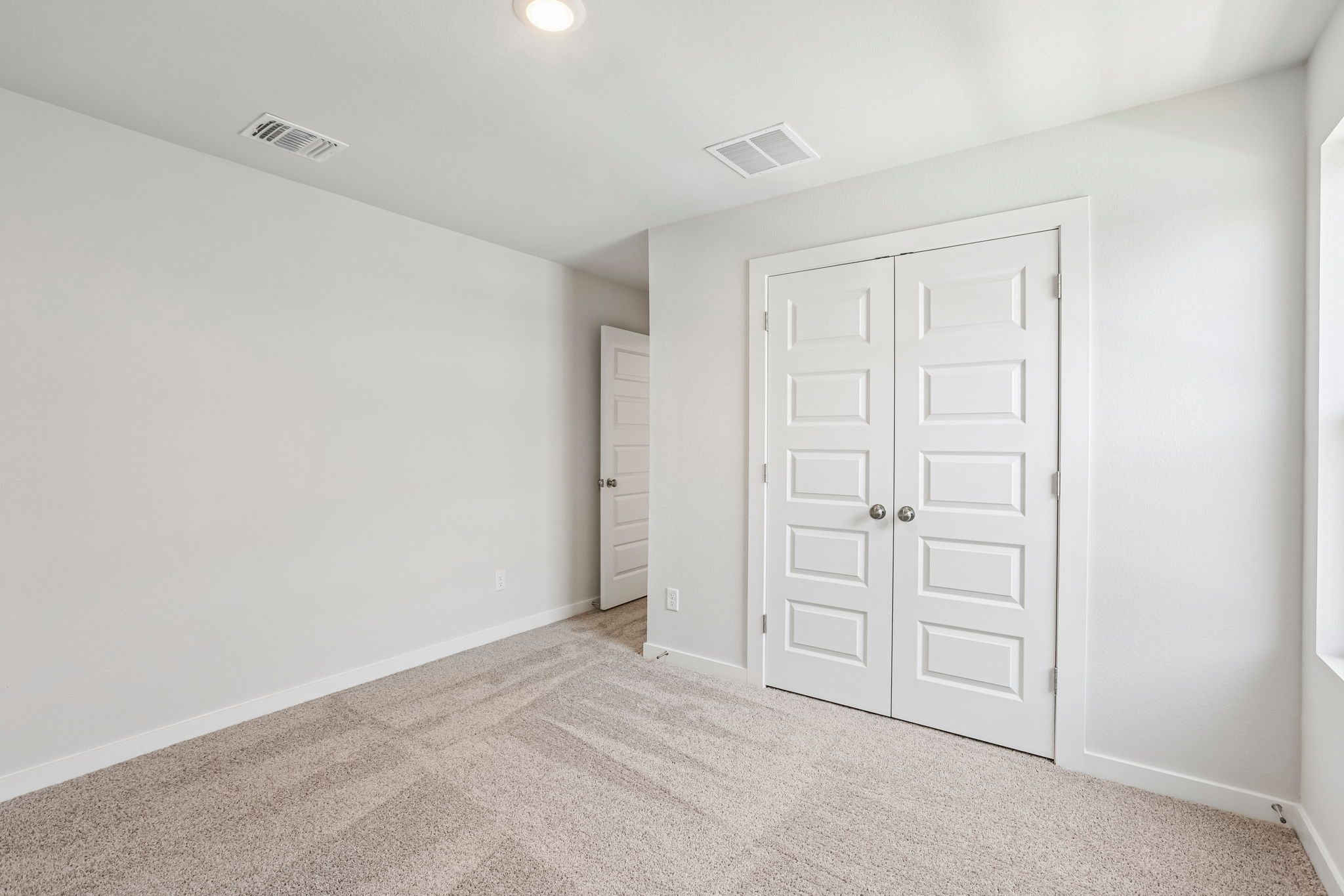 A room with white doors.
