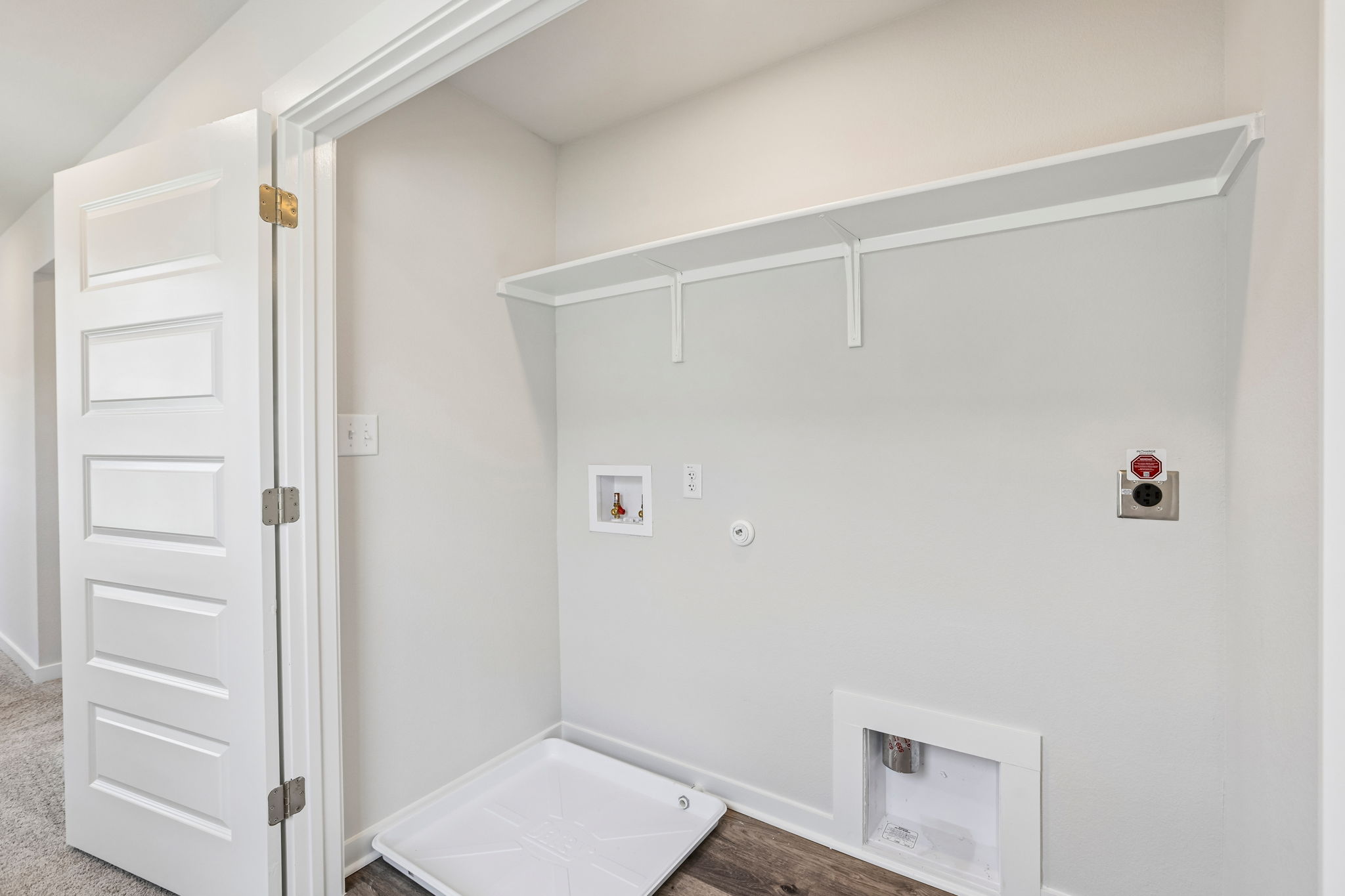 A white room with a white wall.