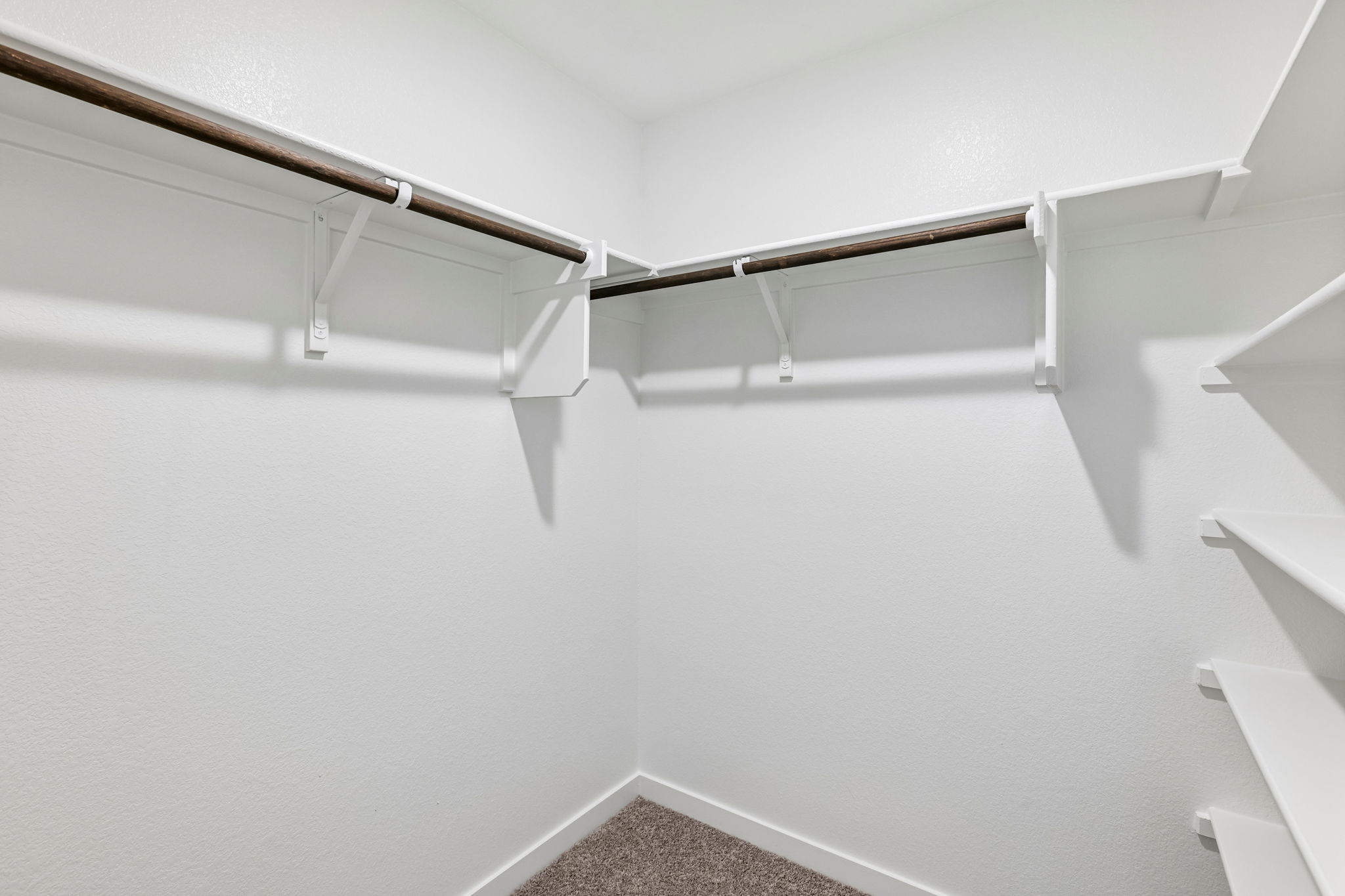 A white staircase with a railing.