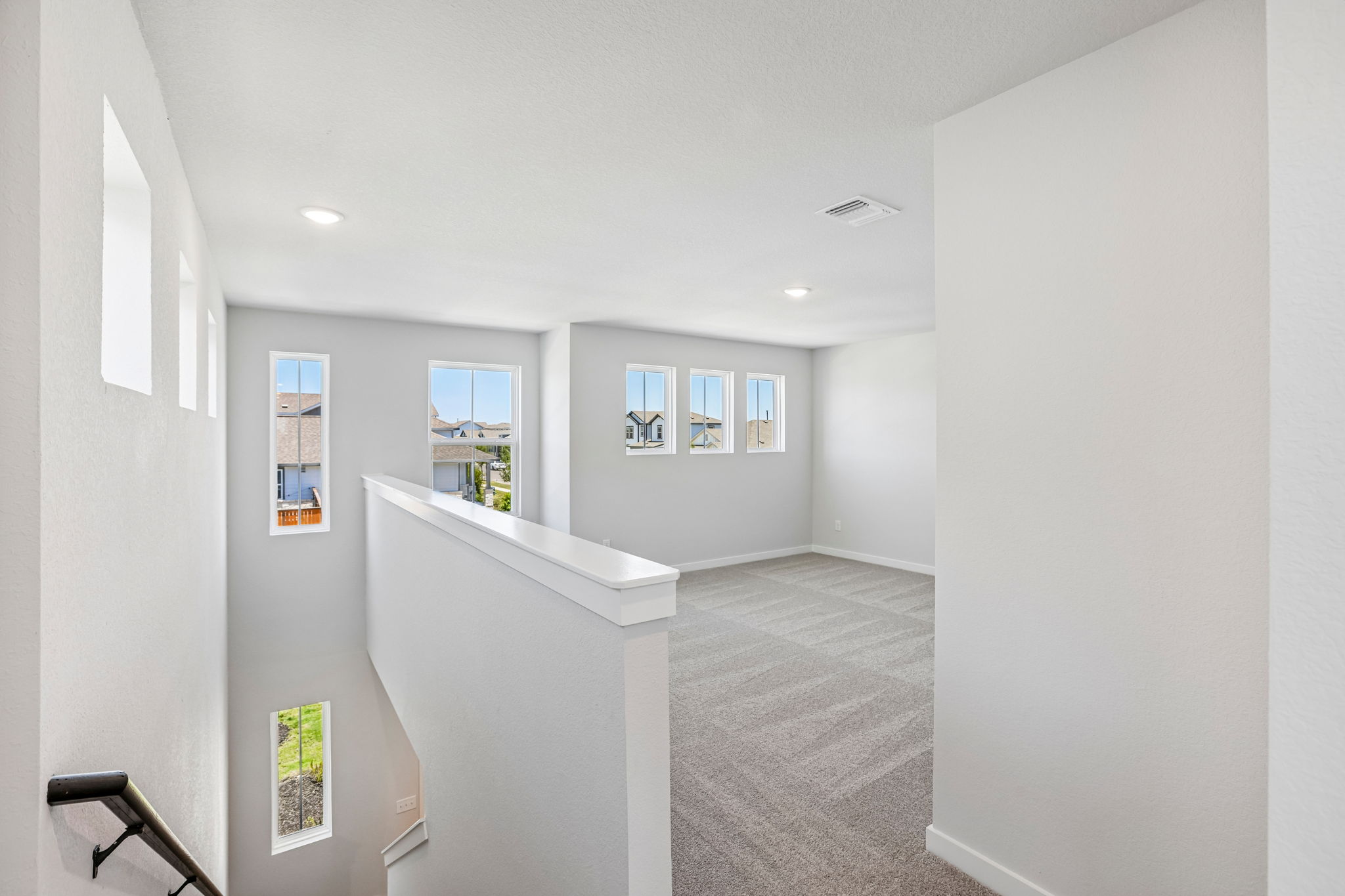 A hallway with white walls.